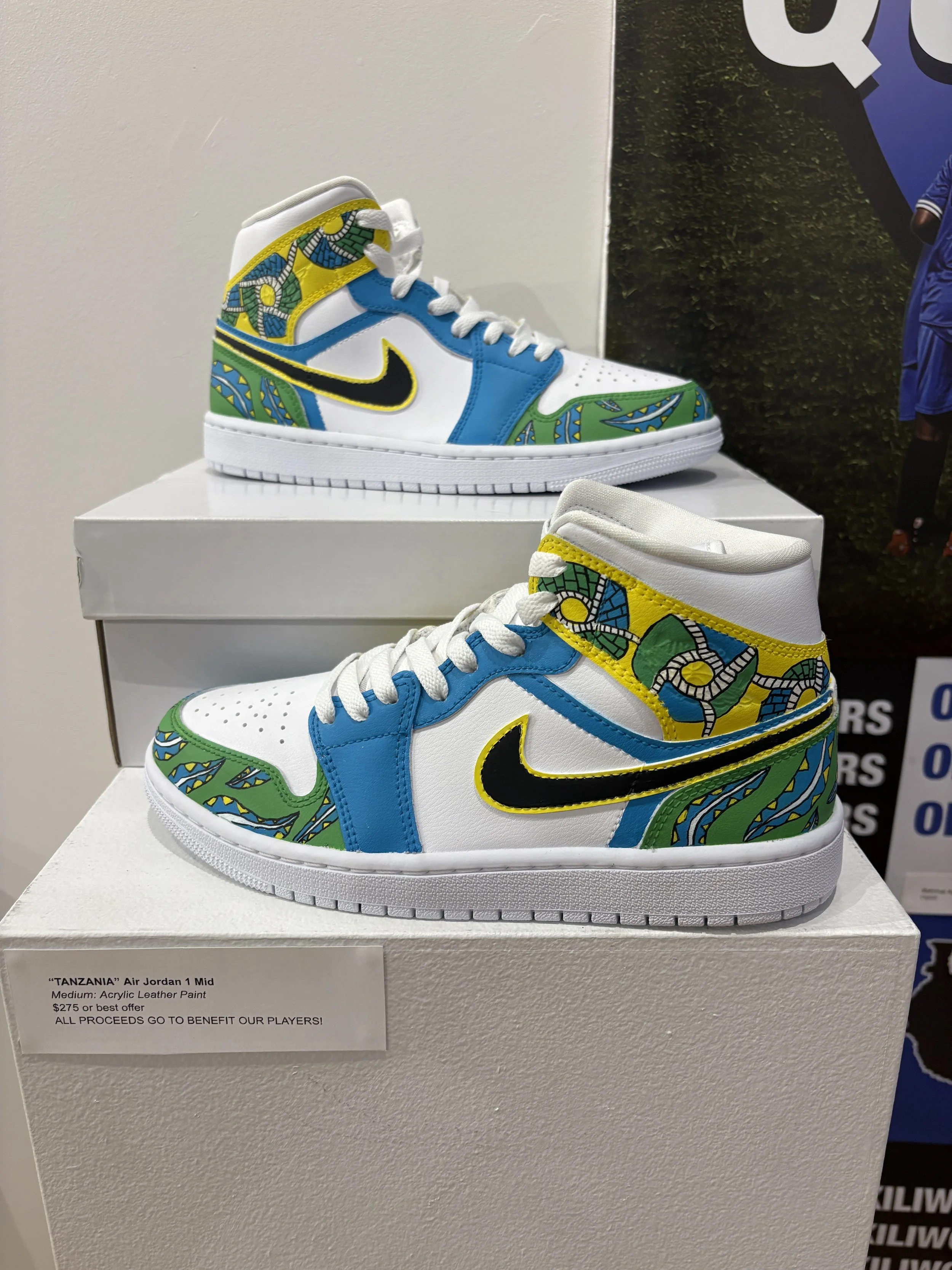 Hand-painted shoes using inspiration from Tanzanian textile designs and flag colors