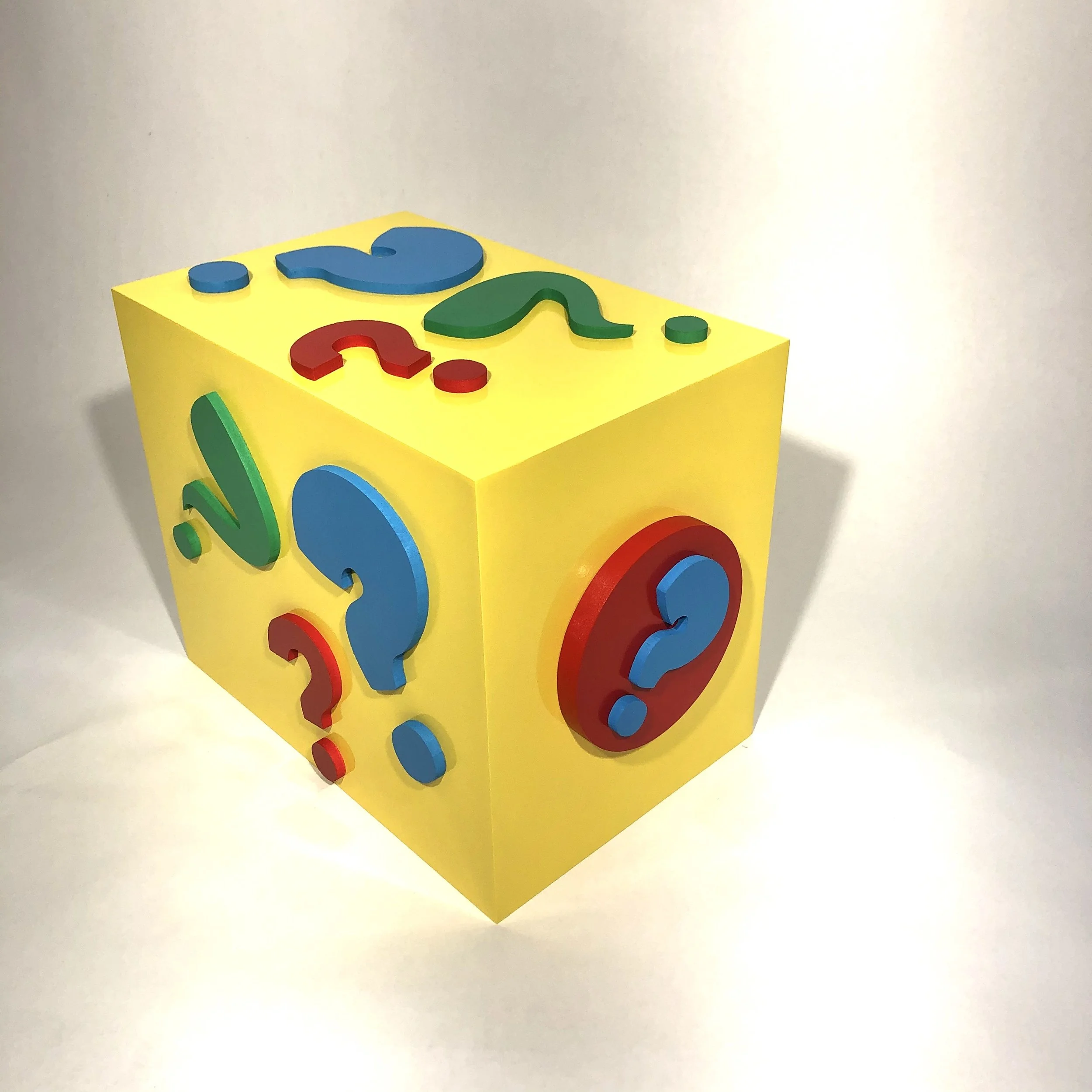 Yellow children's puzzle block with colorful raised animal shapes and pieces