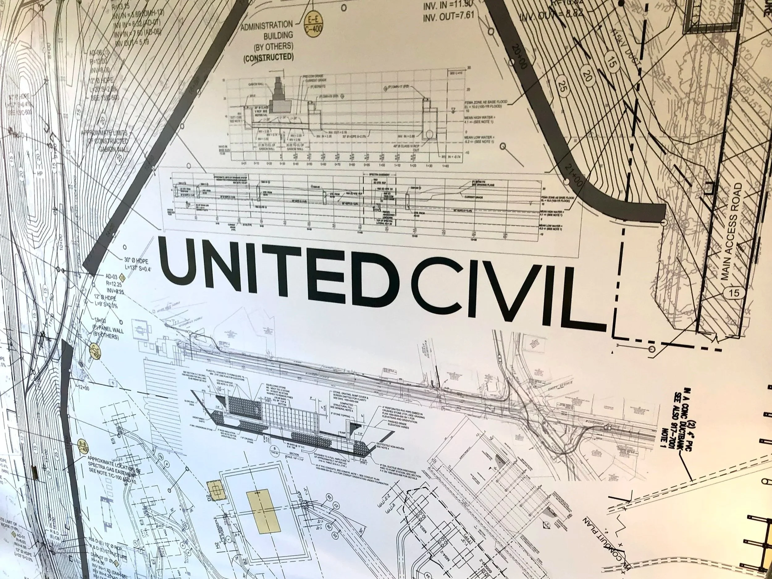 Engineering construction plans showing utility layouts, site grading contours, road access, and detailed infrastructure diagrams.