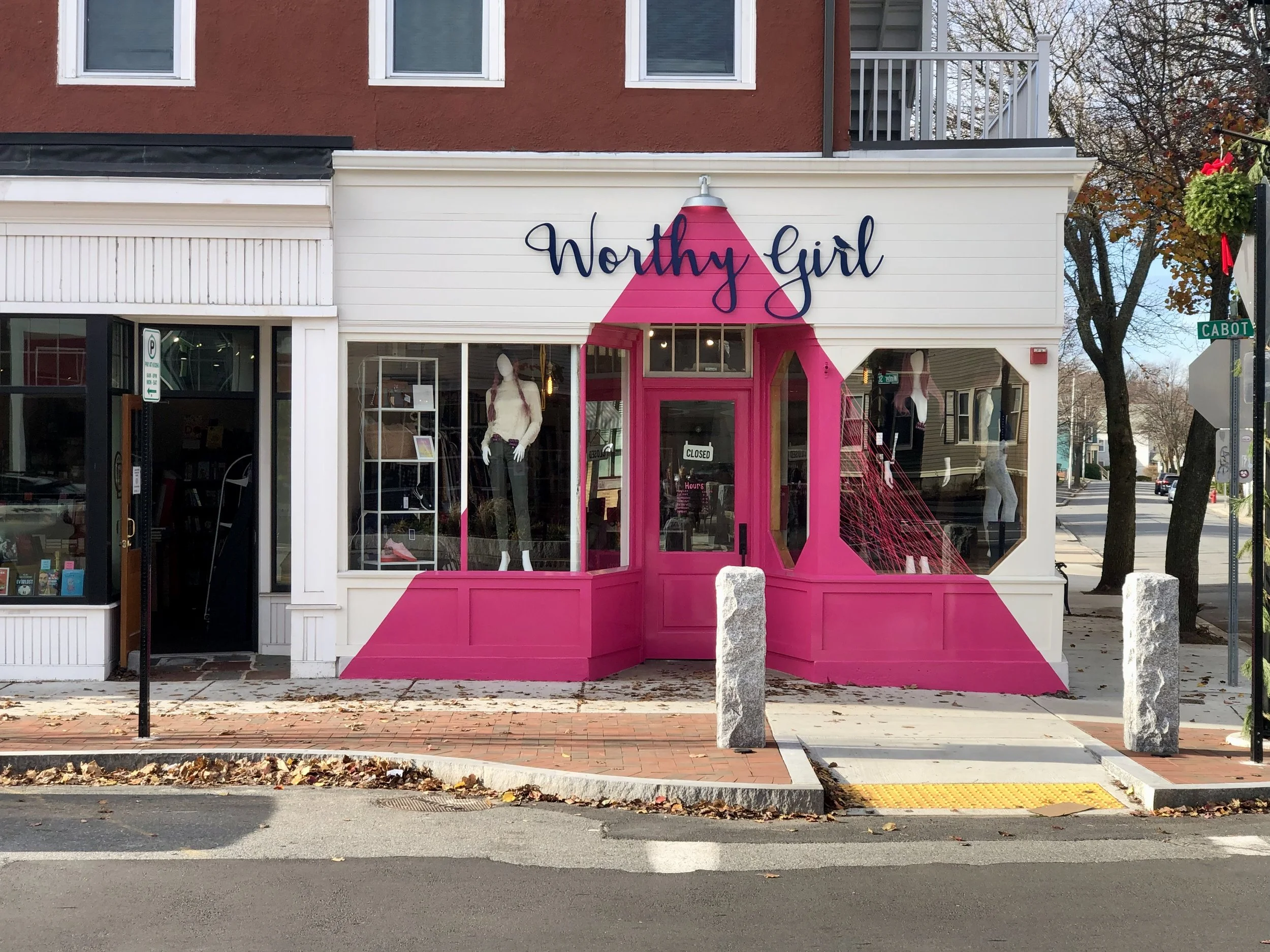 Worthwhile Girl clothing boutique with bright pink storefront on Cabot Street