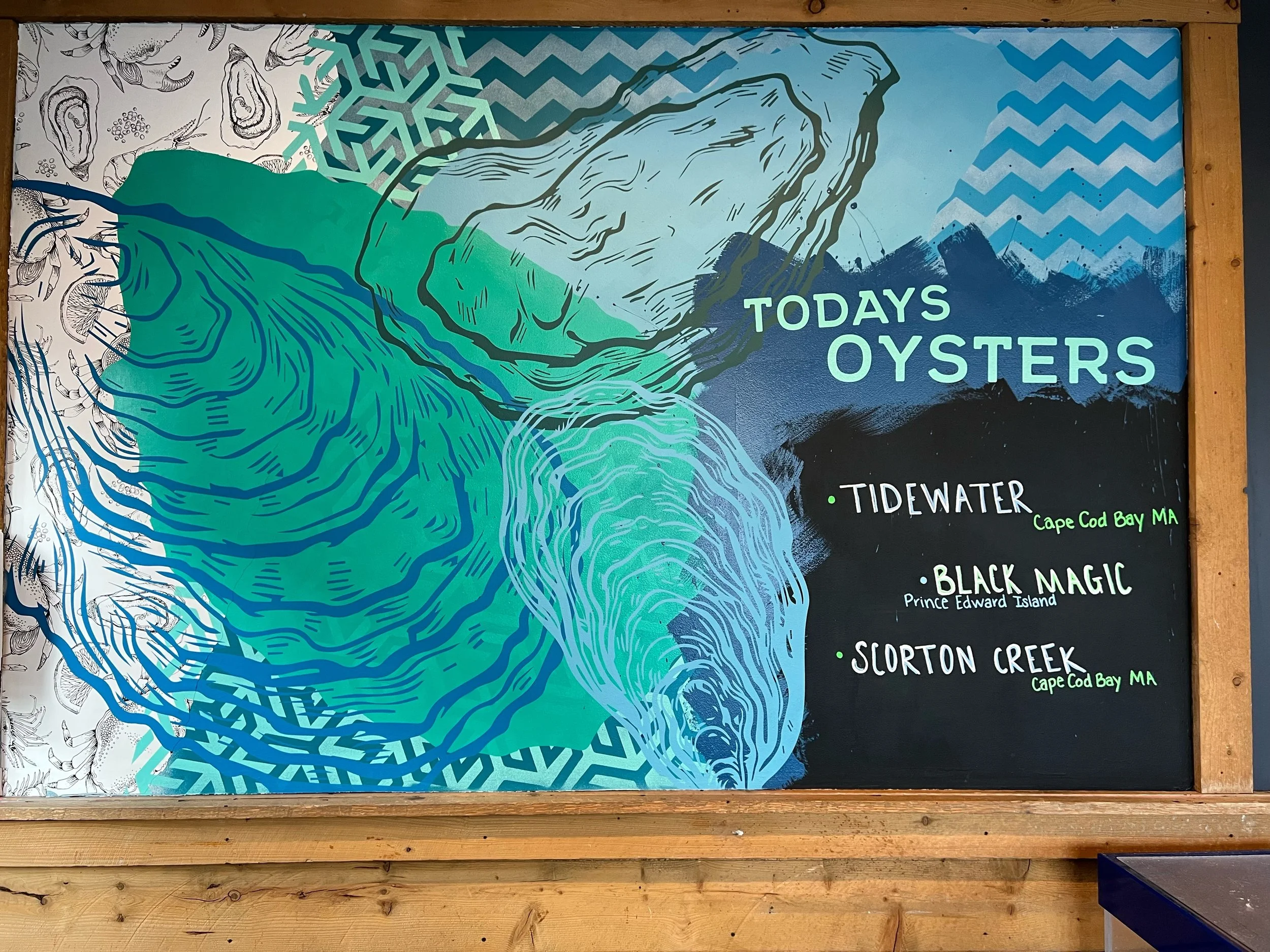 Colorful oyster-themed mural reading “Today’s Oysters,” listing Tidewater, Black Magic, and Scorton Creek oysters.