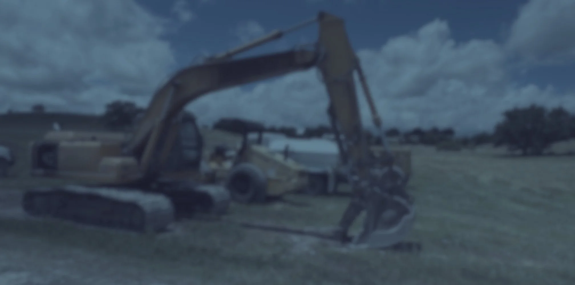 Excavator preparing a house pad in Central Texas