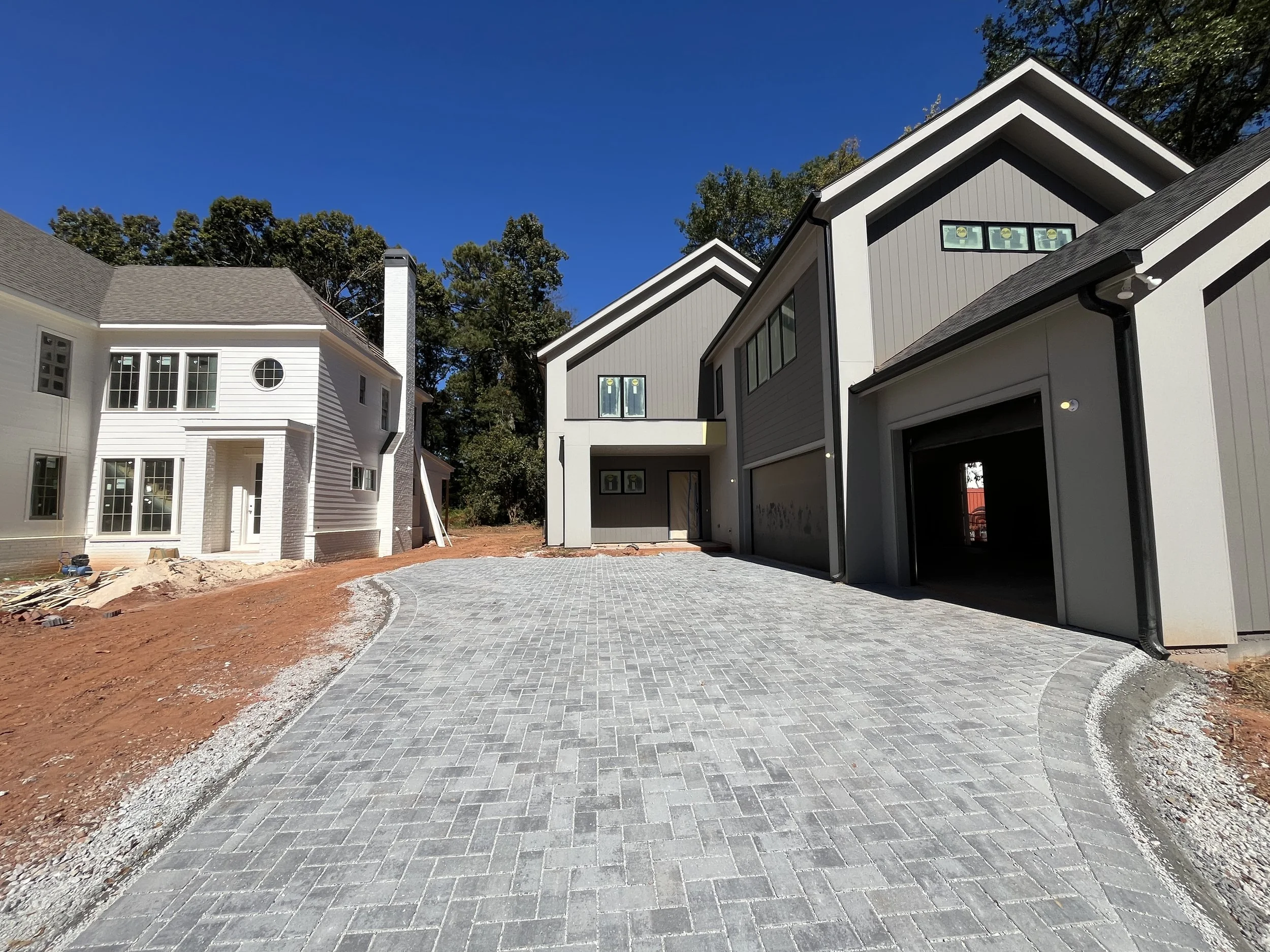 Newly built modern houses under a clear blue sky