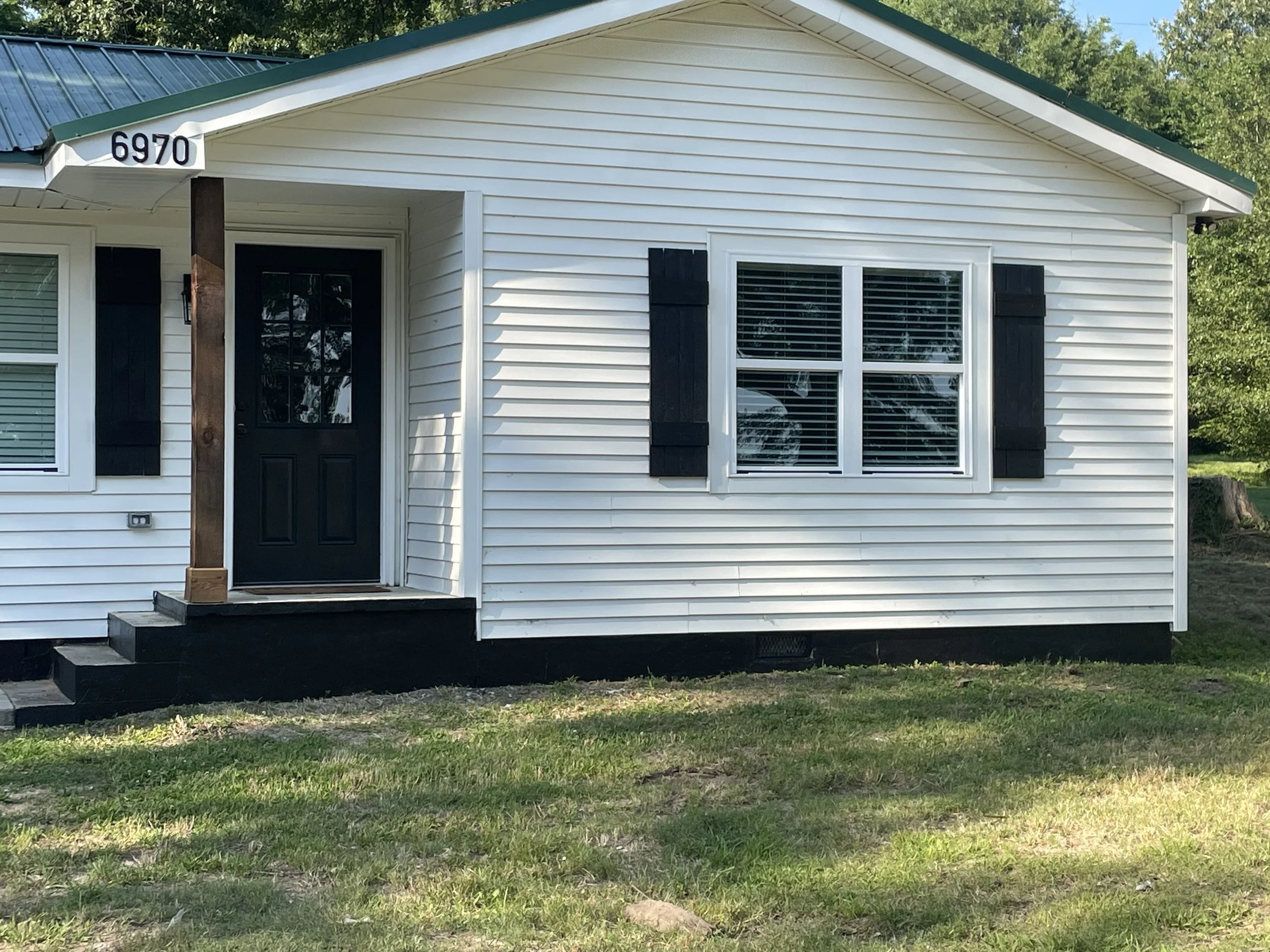 Painted shudders, stained cedar columns, and painted house foundation, Memphis, TN