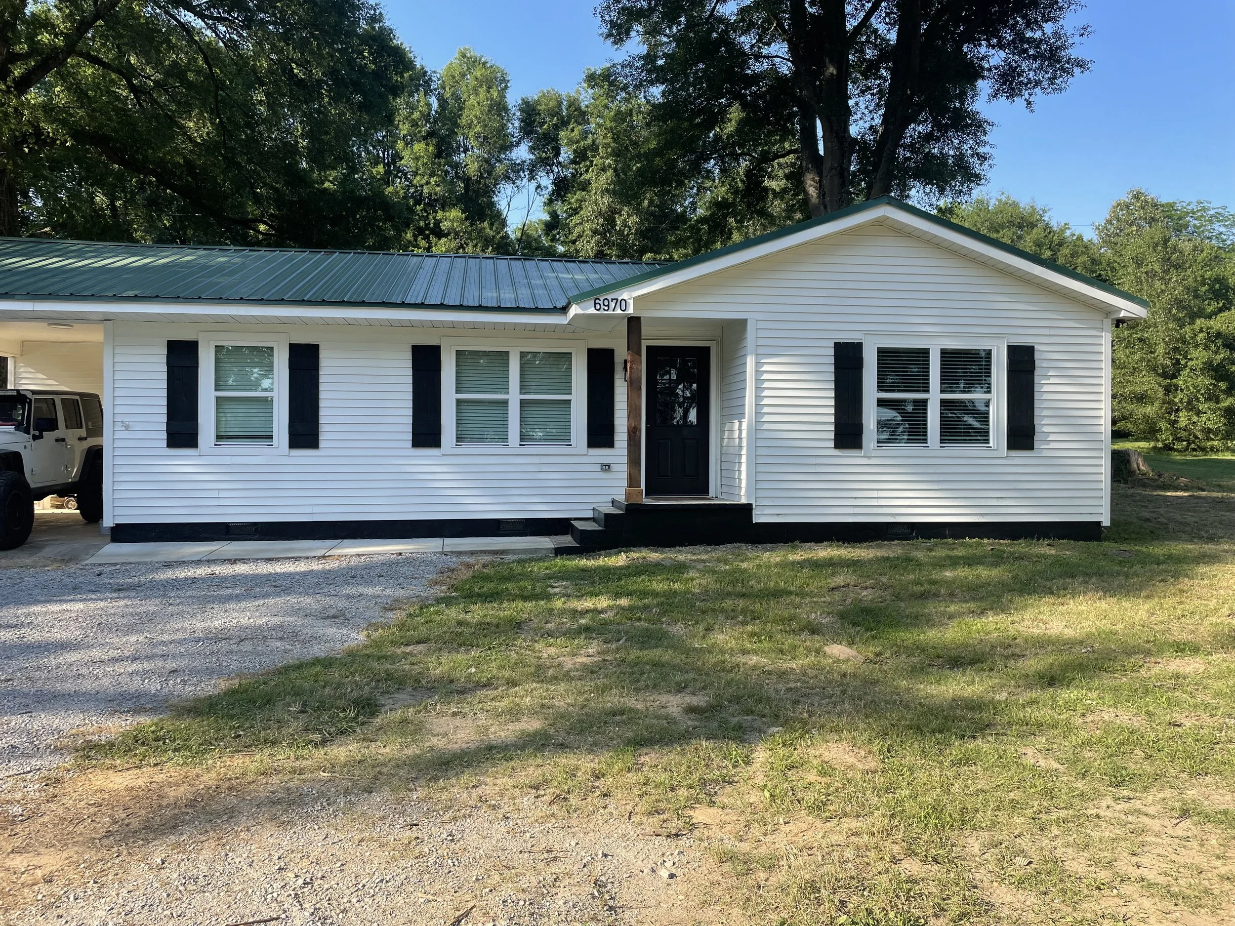 Painted shudders, stained cedar columns, and painted house foundation, Memphis, TN
