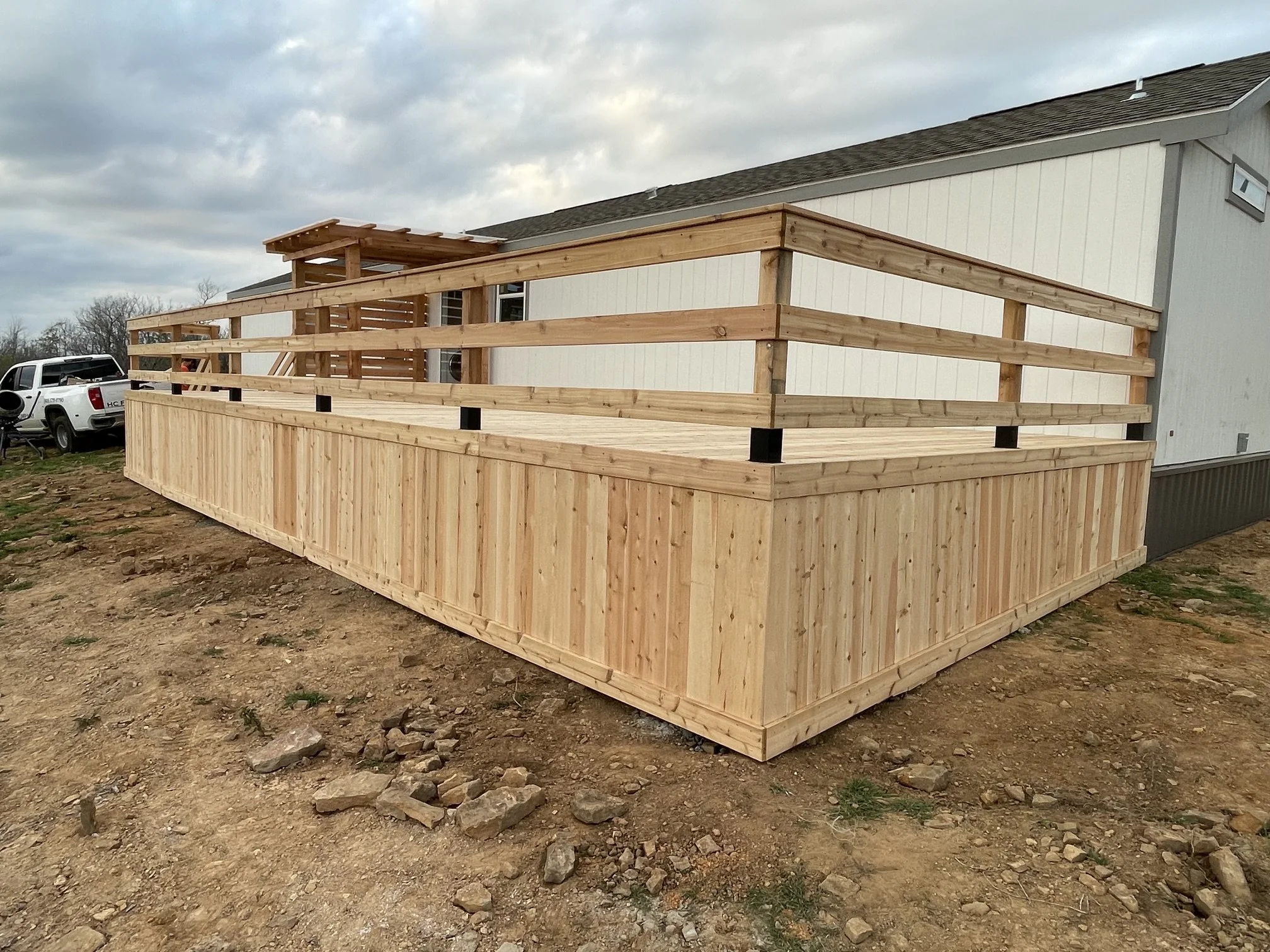 Cedar deck with custom pergola, railing, and cedar skirting, Memphis, TN