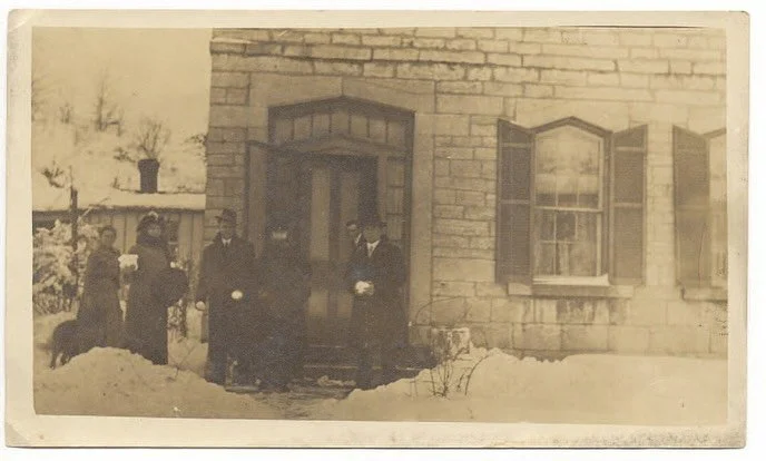 Frozen in time.

A winter day at the Guertler House, sometime around 1910.

The snow is packed, the air looks bitterly cold, and everyone is bundled in heavy wool&mdash;the women with their hands tucked into fur muffs. You can almost imagine the smel