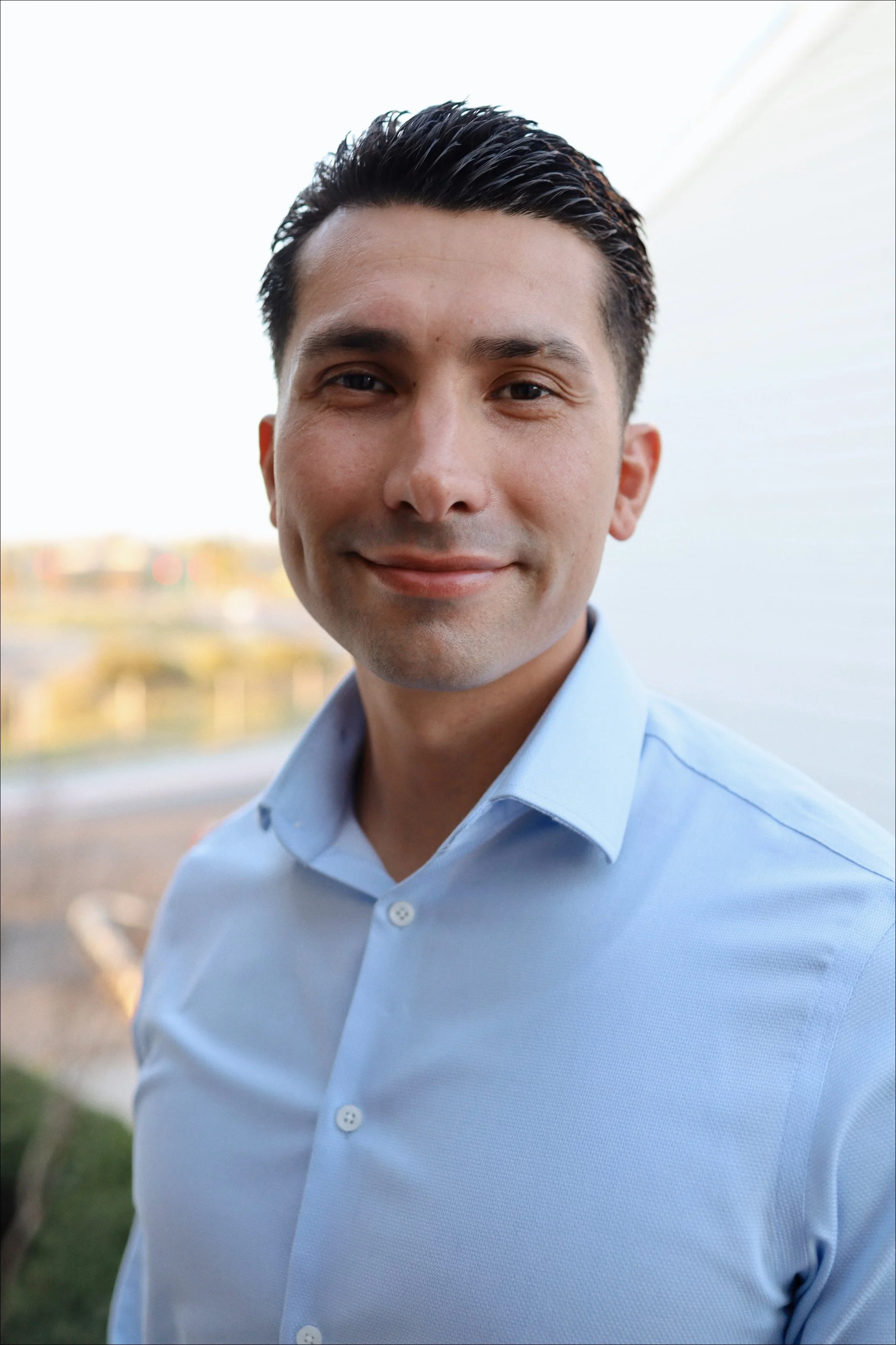Devin Alcántar, owner of XMAS Lights Fresno, smiling in a professional headshot.