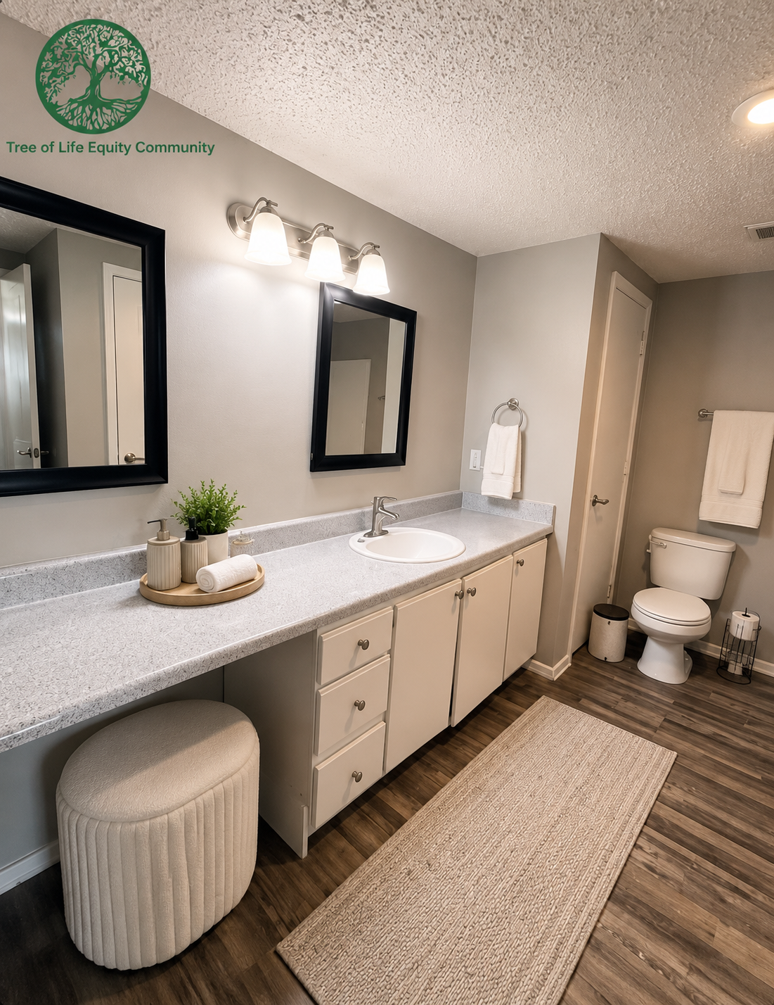 Spacious bathroom with an extended vanity, bright lighting, modern finishes, and plenty of counter space.
