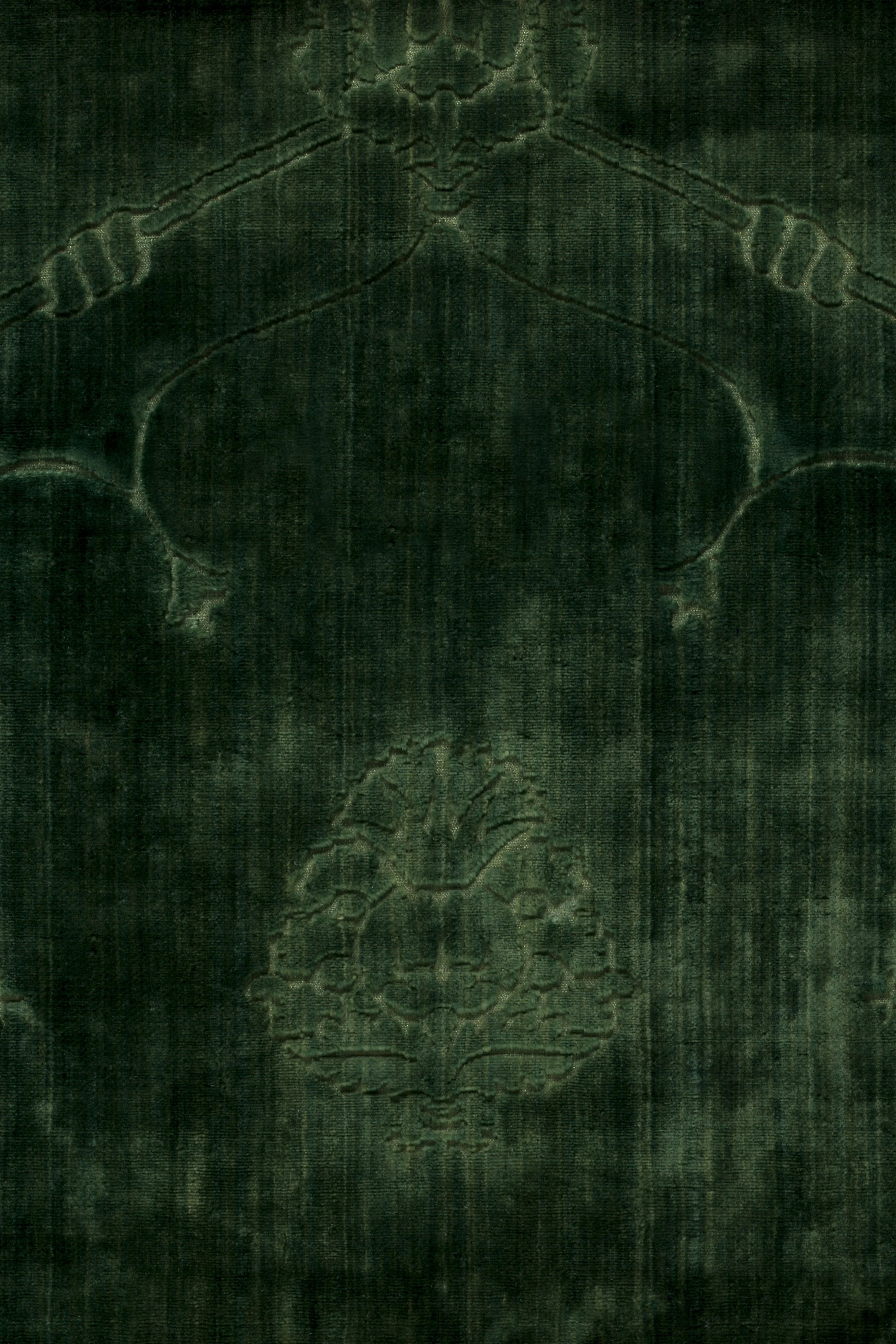A dark-colored book cover with embossed decorative elements and a central emblem, possibly an antique or vintage book.
