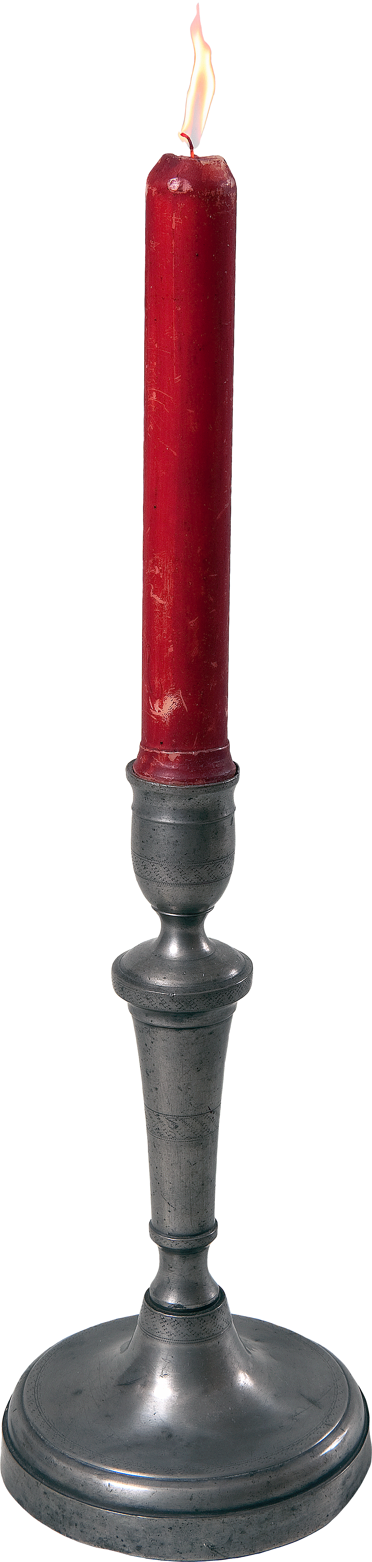 A large red candle with a flame at the top, mounted on a black metal candle holder with a round base.