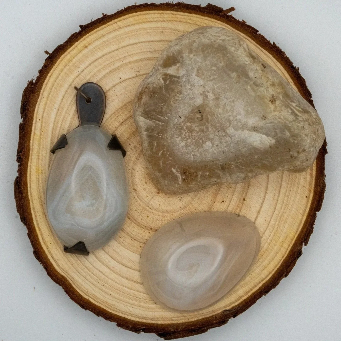 A locally discovered rock turned into a cabochon and make into jewelry.