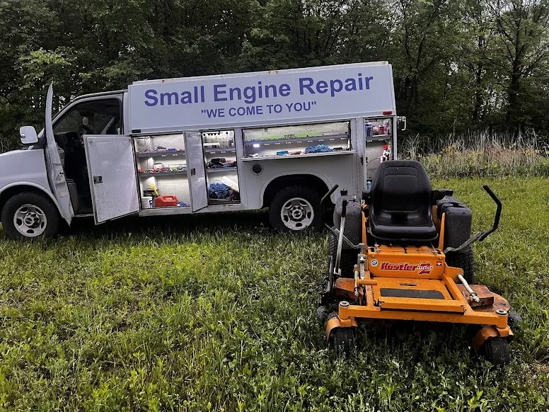 Buckeye Mower Repair service van and orange riding mower at a customer location