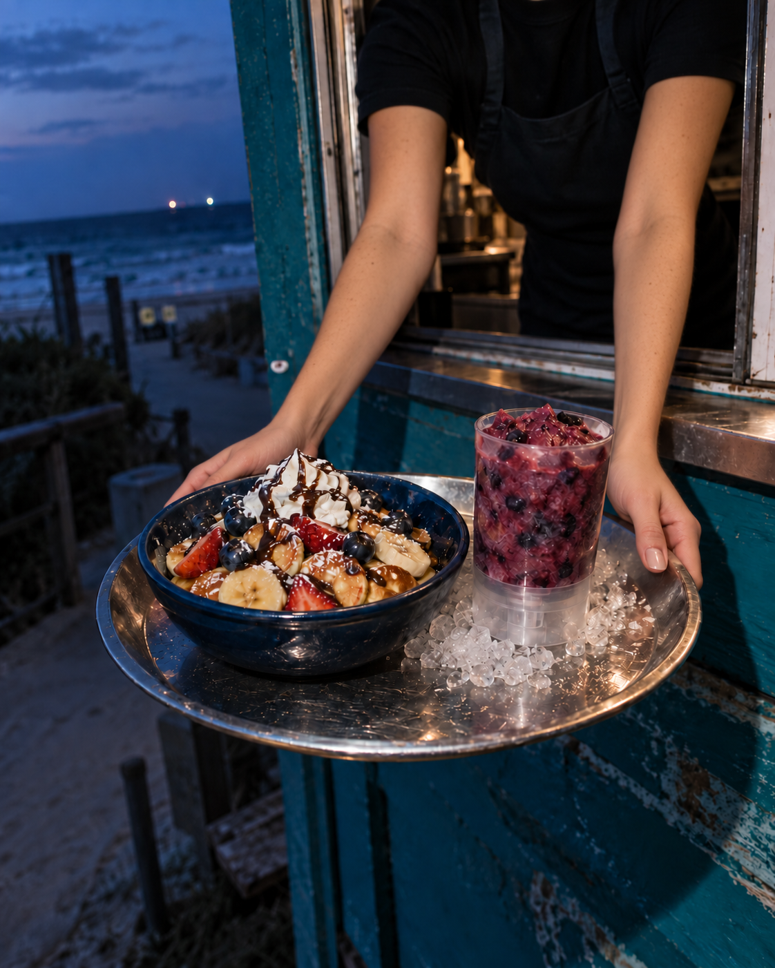TideHaus team member carrying a mini pancake bowl and blueberry raspberry Tidesicle near the beach.