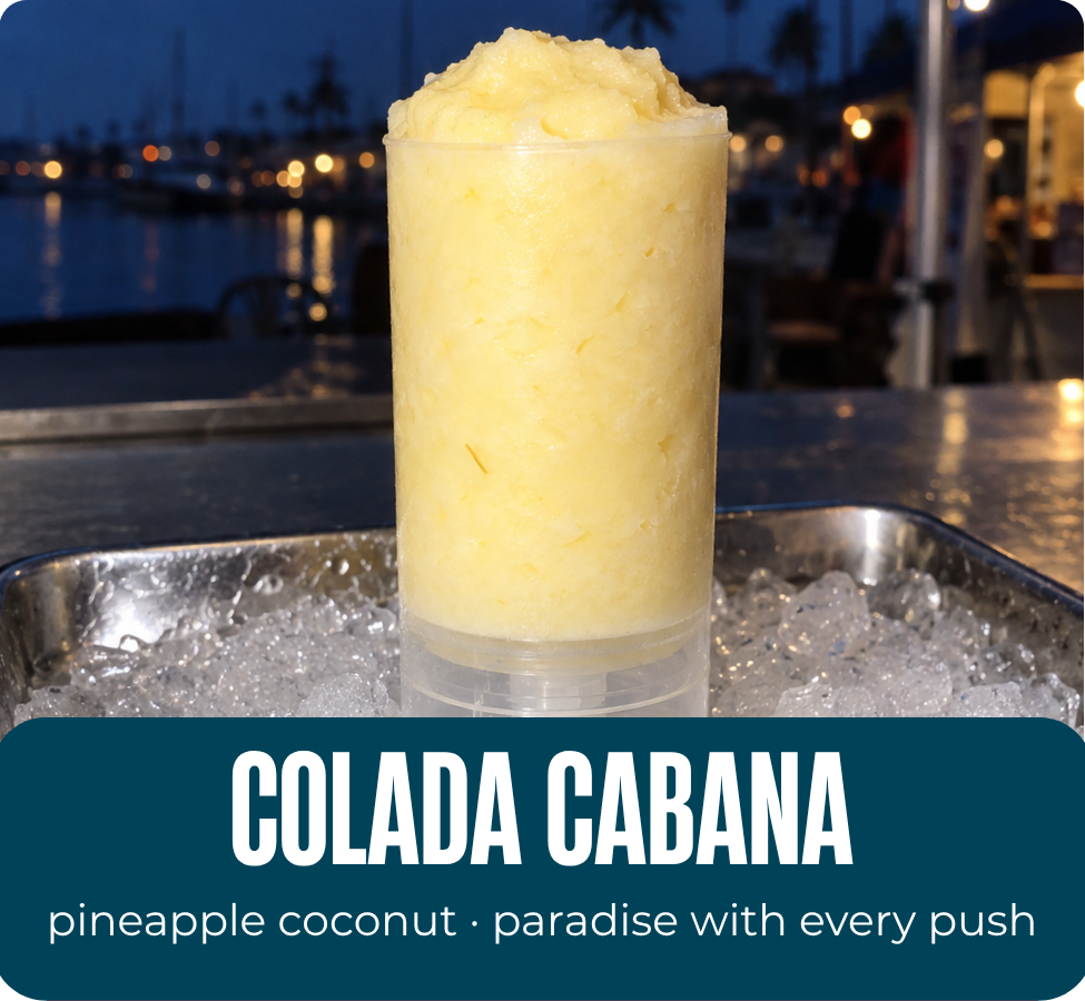 Colada Cabana pineapple coconut Tidesicle displayed over ice at a waterfront marina.