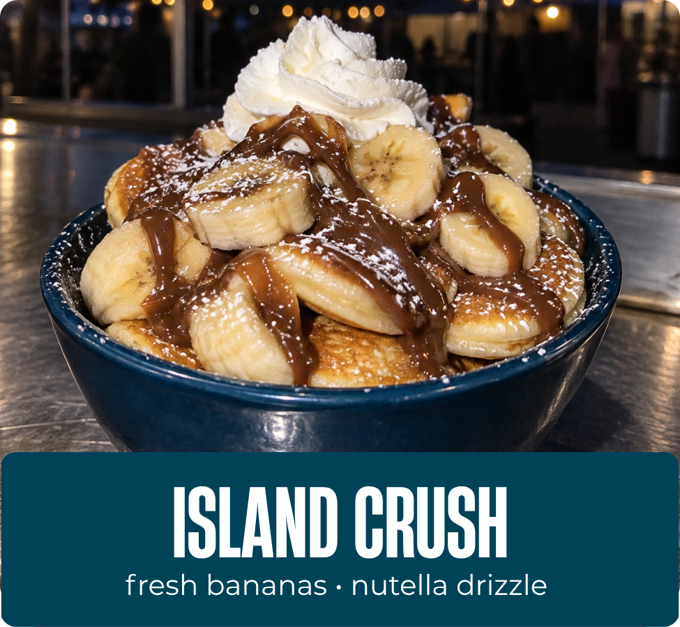 Island Crush mini pancakes with bananas, whipped cream, powdered sugar and Nutella drizzle.
