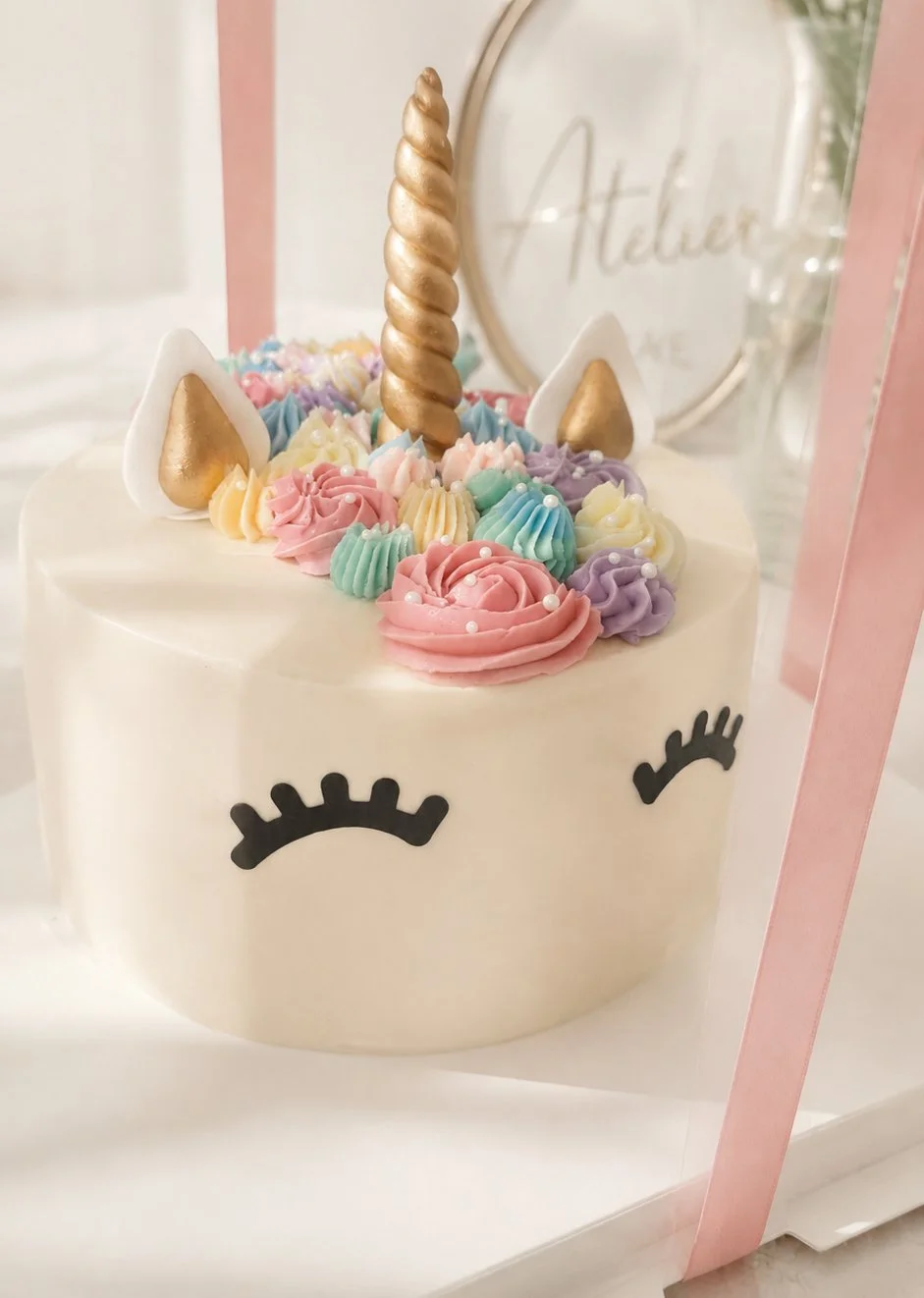 Custom unicorn birthday cake with pastel buttercream flowers by j. atelier cake in Lehi, Utah