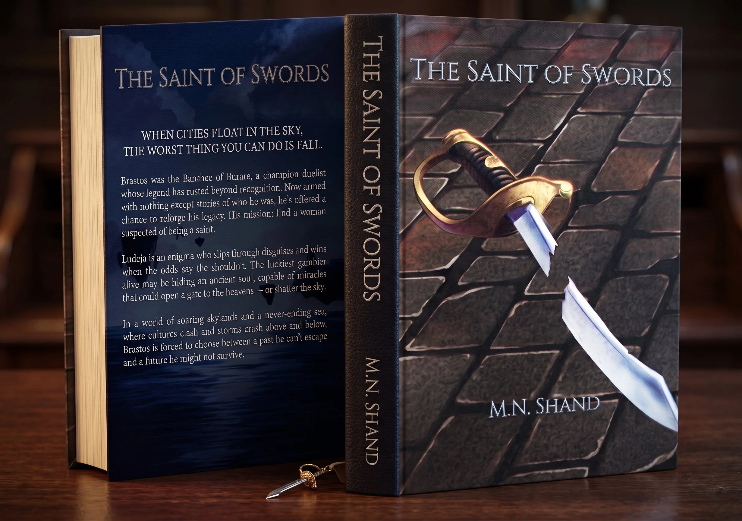 A hardcover book titled 'The Saint of Swords' is displayed open next to another copy of the same book with a sword illustration on the cover, resting on a wooden surface.