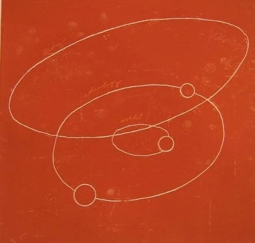White line drawing of an atom with a red background, showing a nucleus and electrons orbiting around.