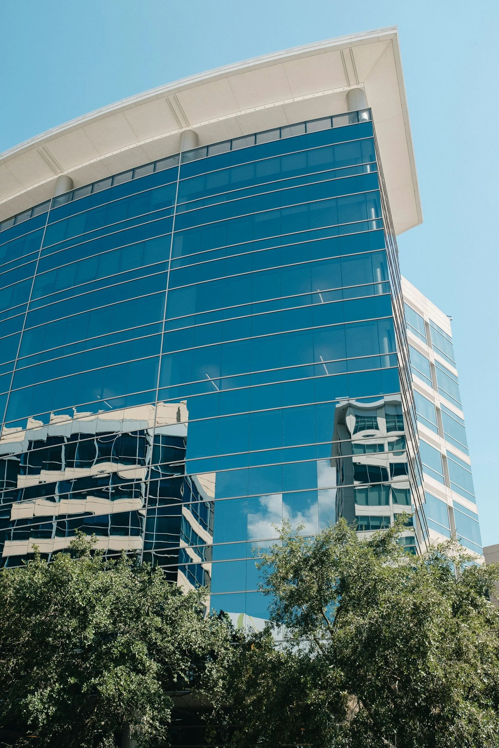 Reflective office building in The Woodlands Texas, Post Induction Therapy available to The Woodlands residents via telehealth
