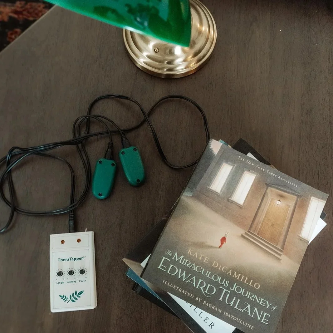 Therapy office details with bilateral stimulation buzzers and books, intensive trauma therapy Scottsdale Arizona