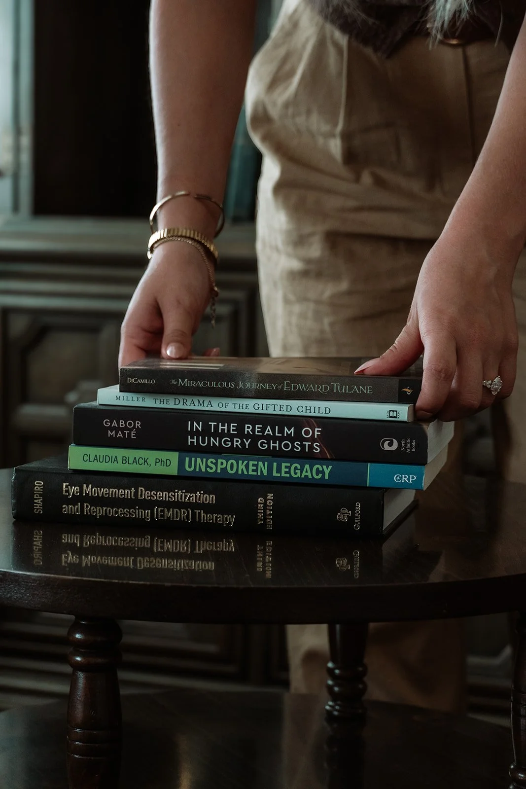 Therapy office bookshelf detail, Post Induction Therapy and childhood trauma treatment Scottsdale Arizona