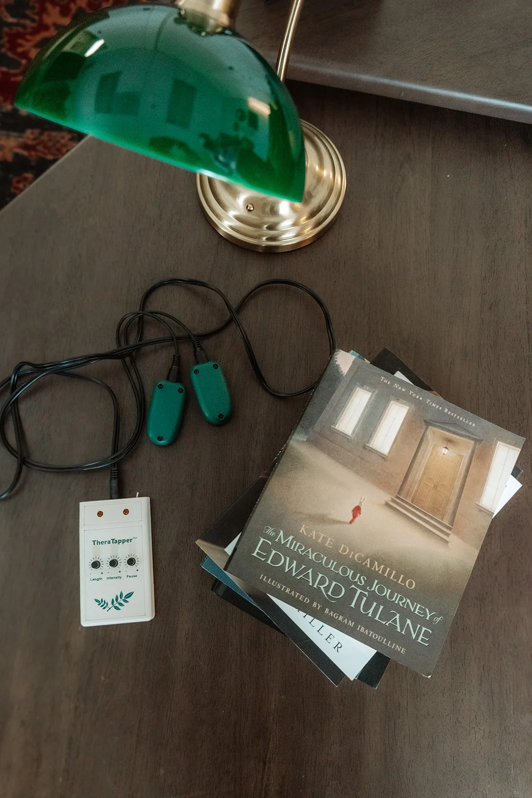 Therapy office with Theratapper bilateral stimulation device and books, EMDR intensive therapy Scottsdale Arizona