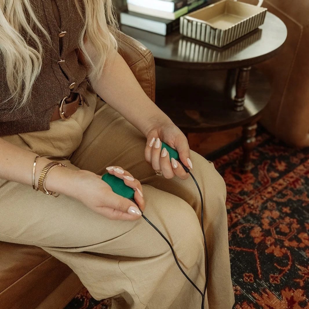 EMDR therapist holding bilateral stimulation buzzers, EMDR therapy Scottsdale Arizona