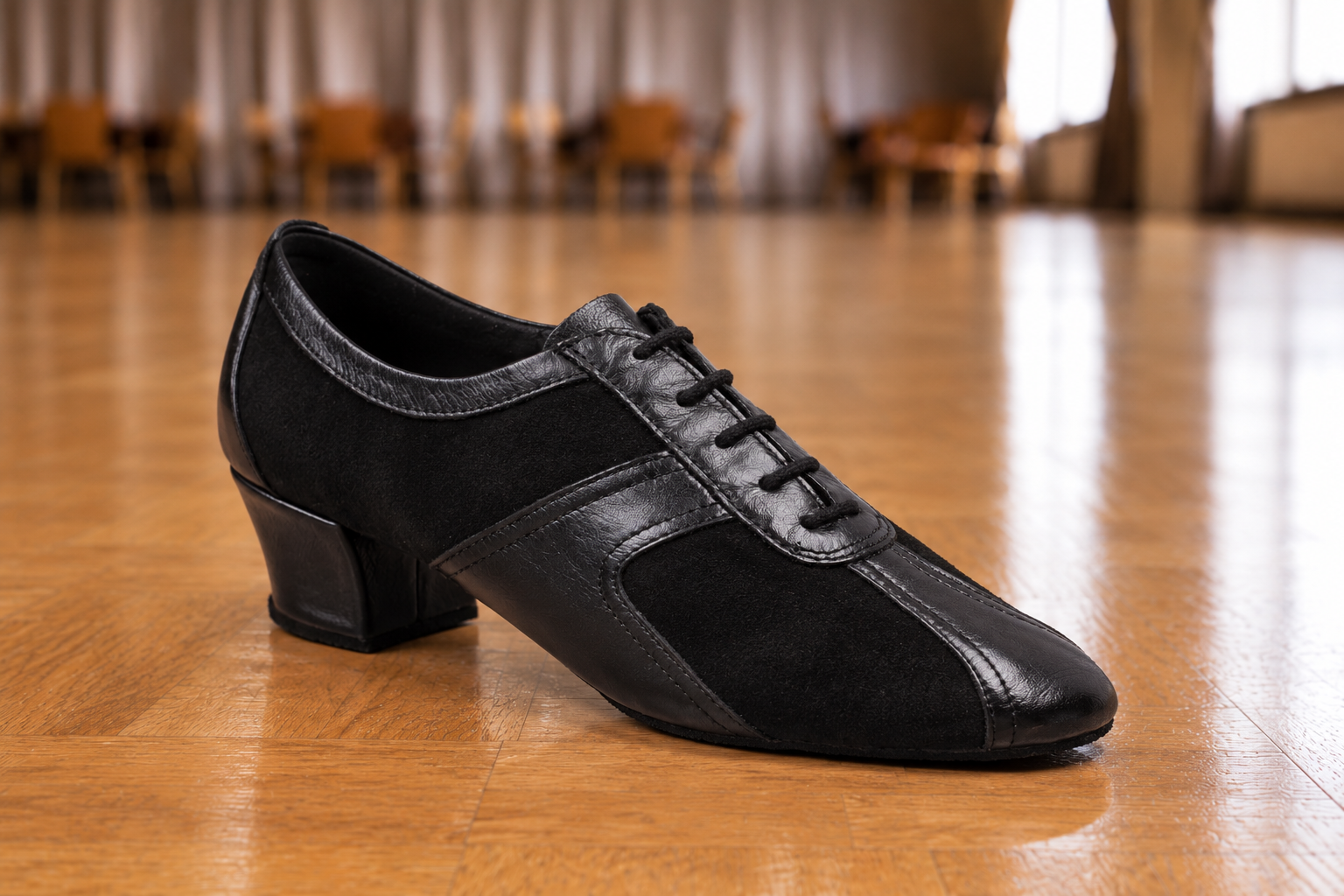 Black Ballroom Dance Shoe on Polished Wood.png