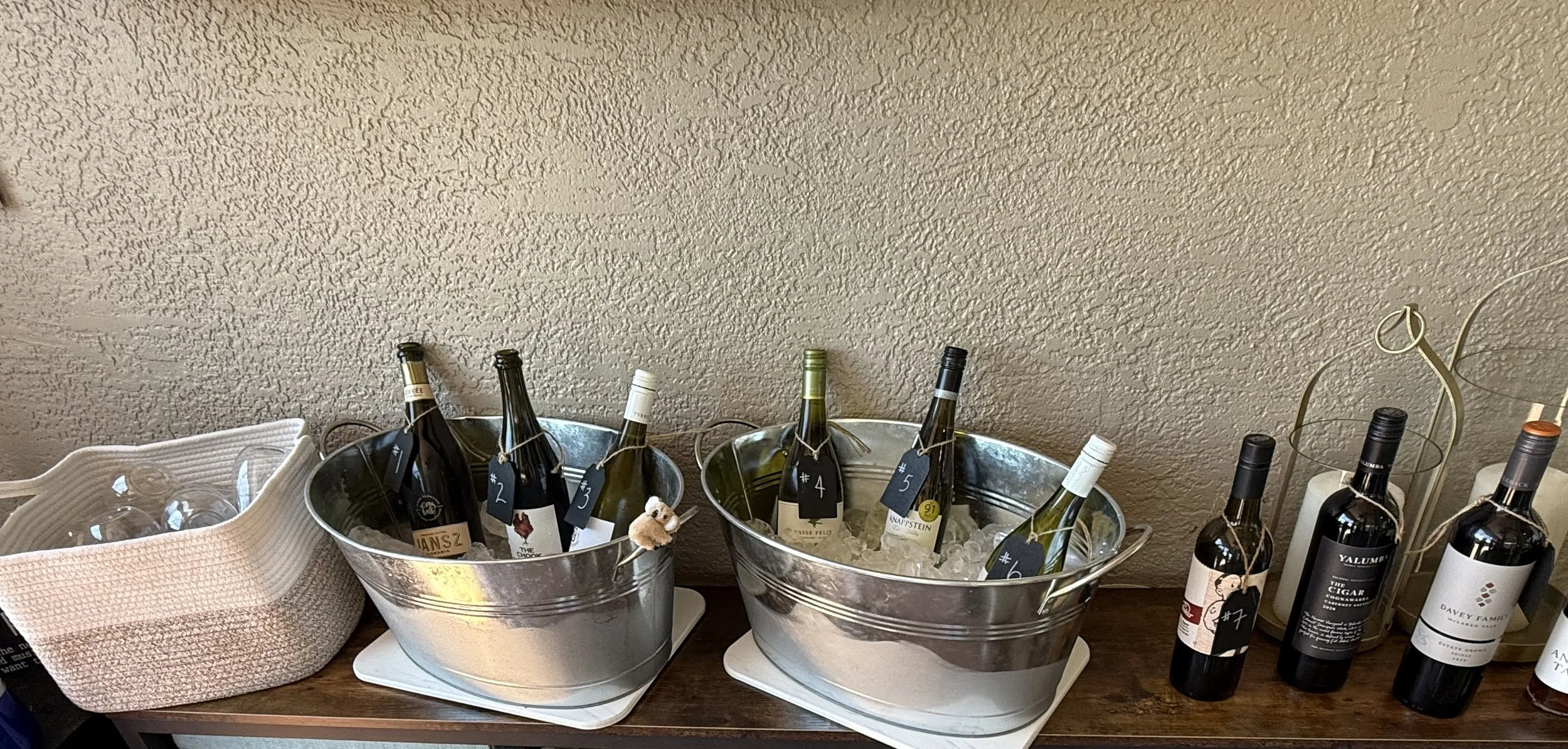 Wine bottles chilling on ice and ready for a group tasting.
