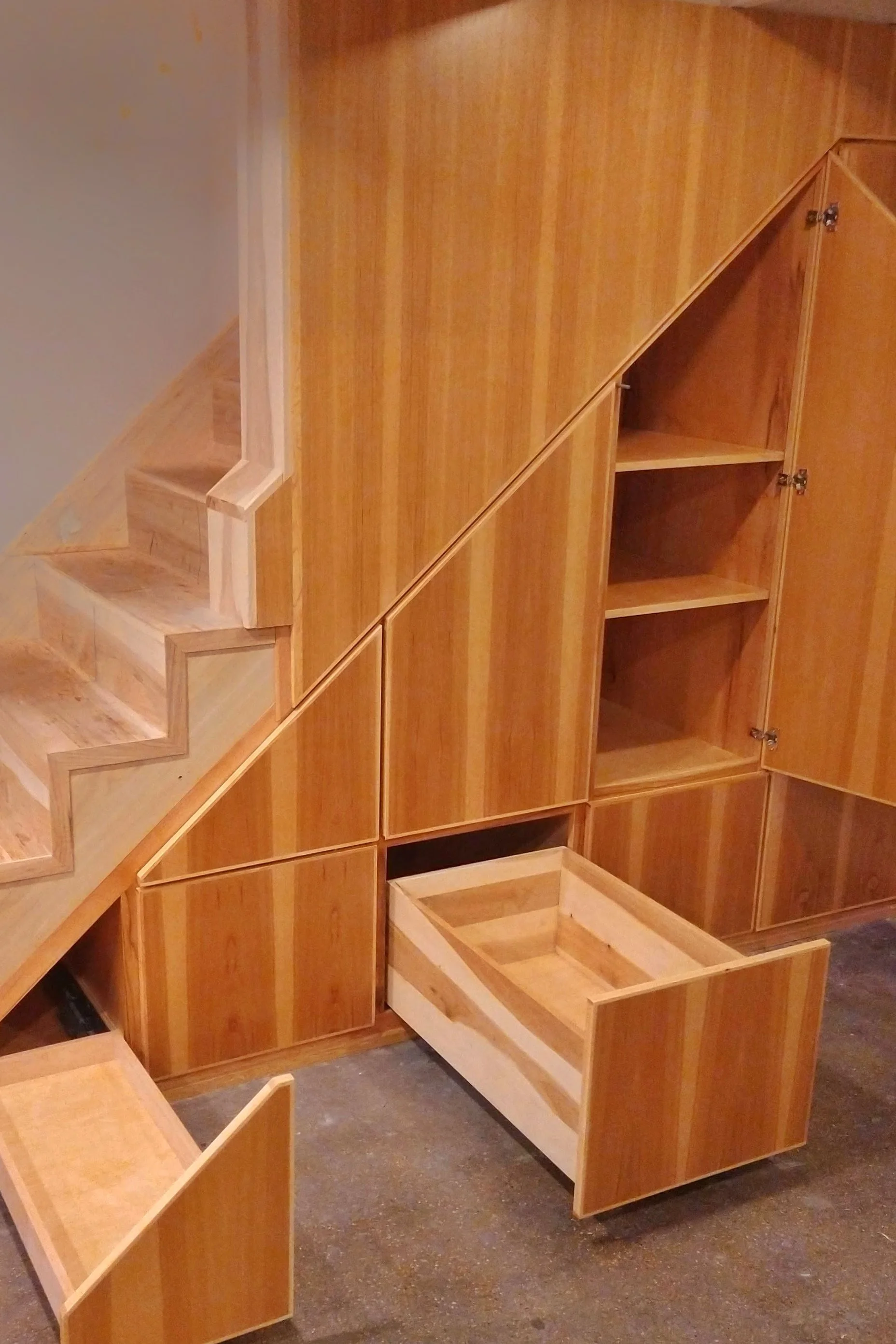 custom stairwell built-ins with drawers