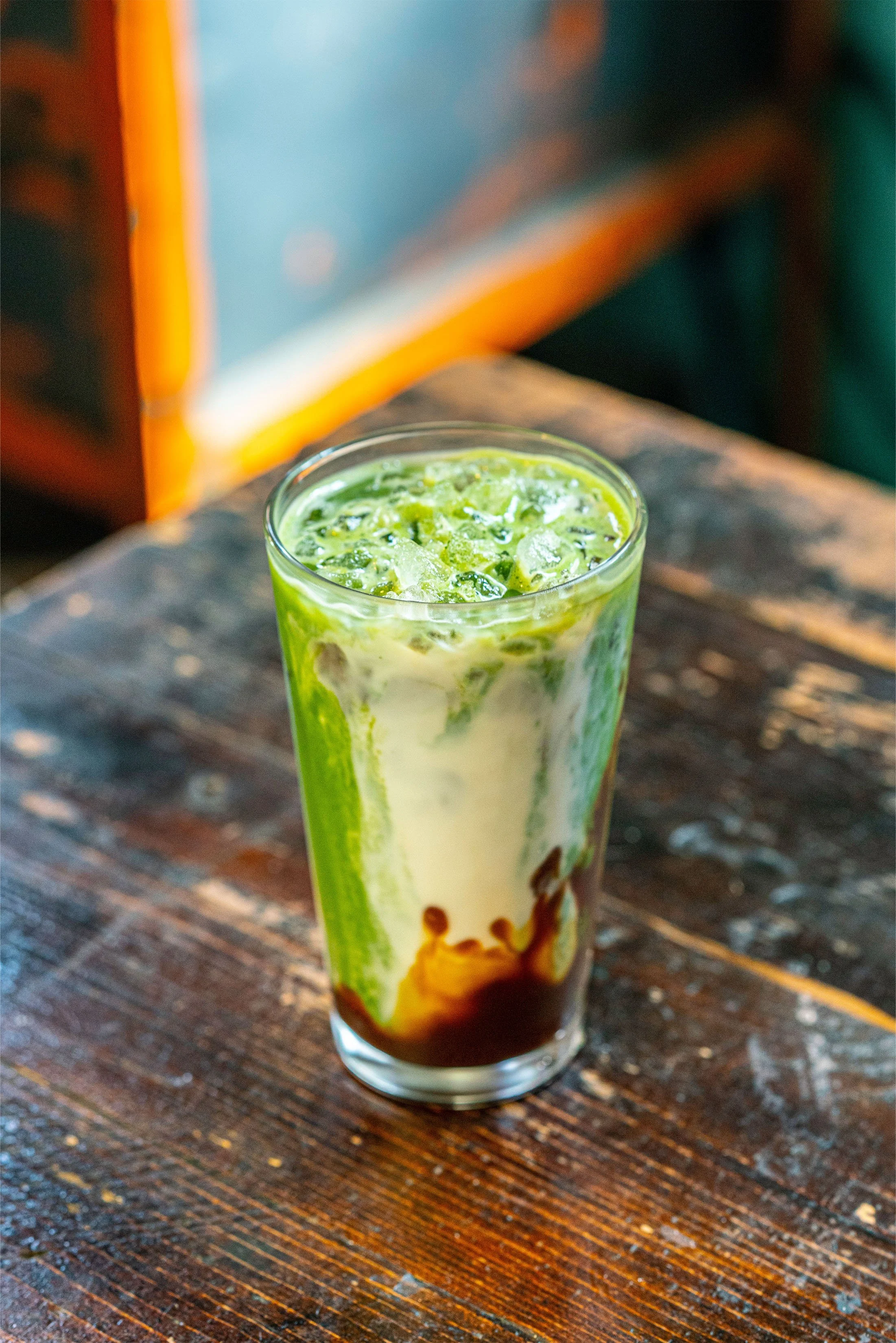 iced ceremonial matcha with strawberry syrup at slowbird matcha and coffee shop, cayucos,ca