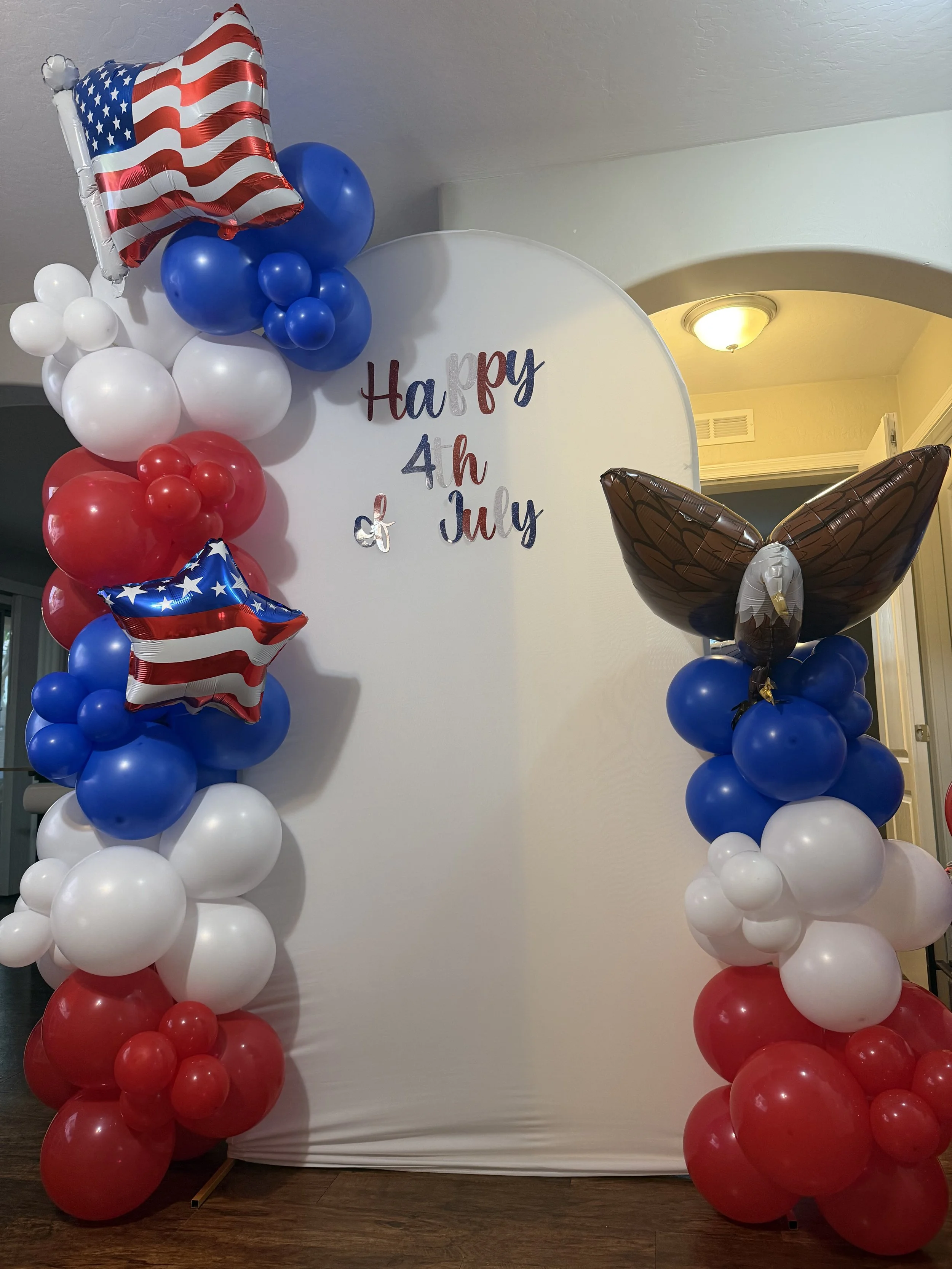 Single 7ft arch with total of 9ft of balloon garland. 