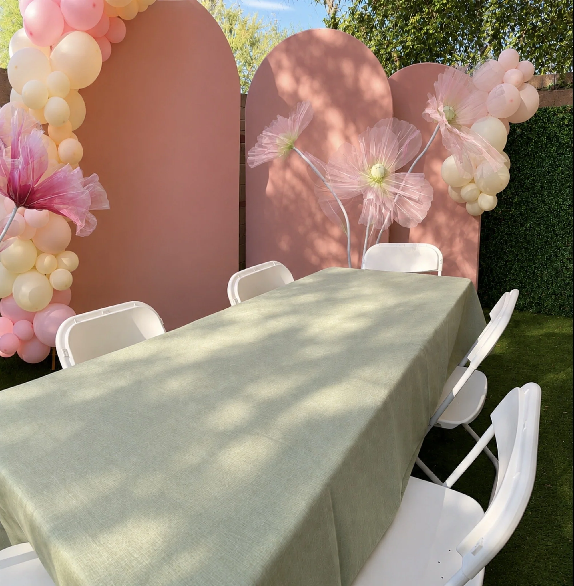 Rental package: tables and chairs. 3 arches, balloon garlands, giant flowers