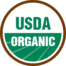 USDA Organic certification logo with green and white text inside a round brown border