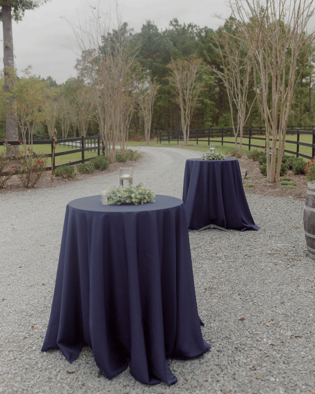wedding cocktail tables with navy blue polyester linens
