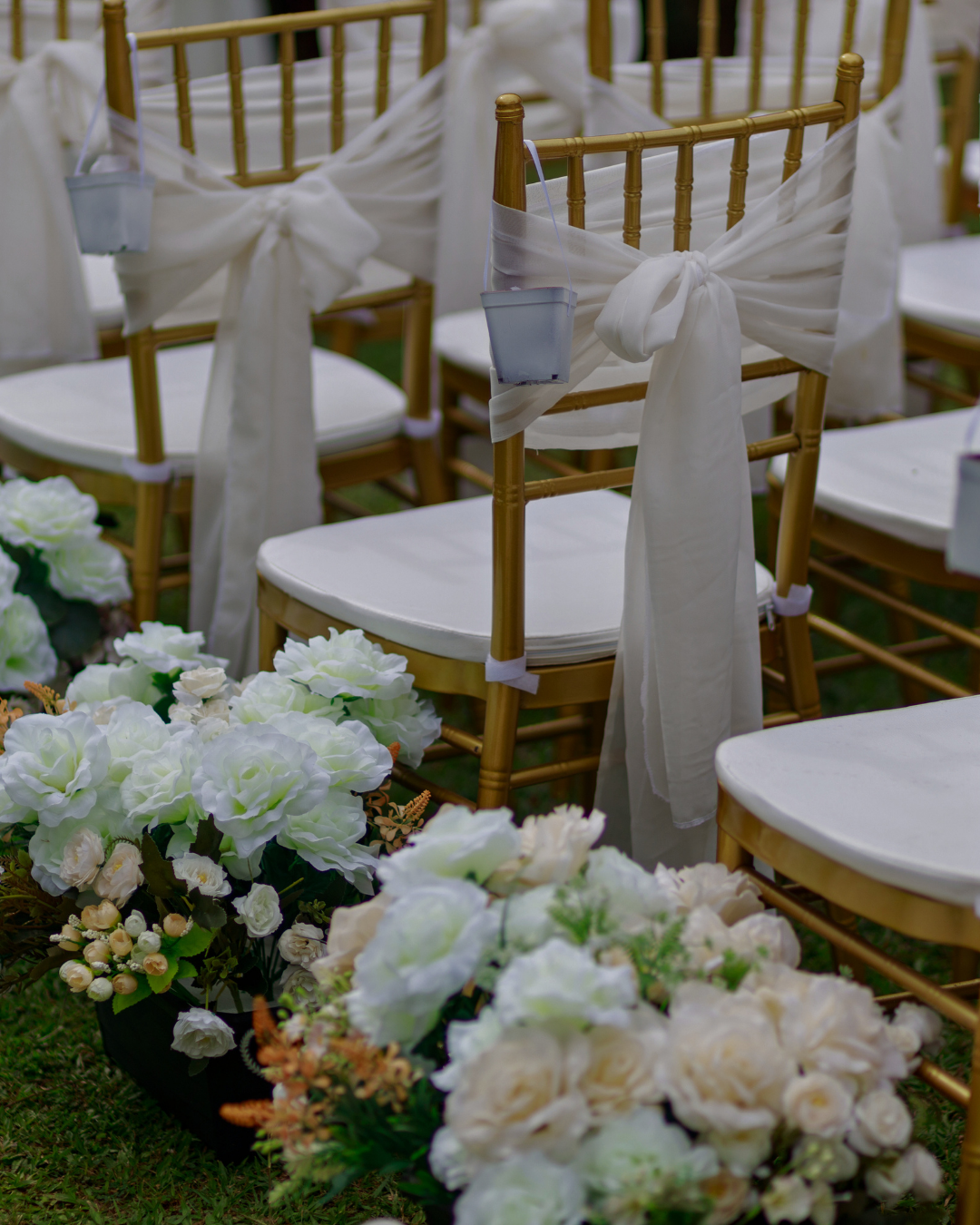 gold chiavari chair rentals placed for a wedding ceremony