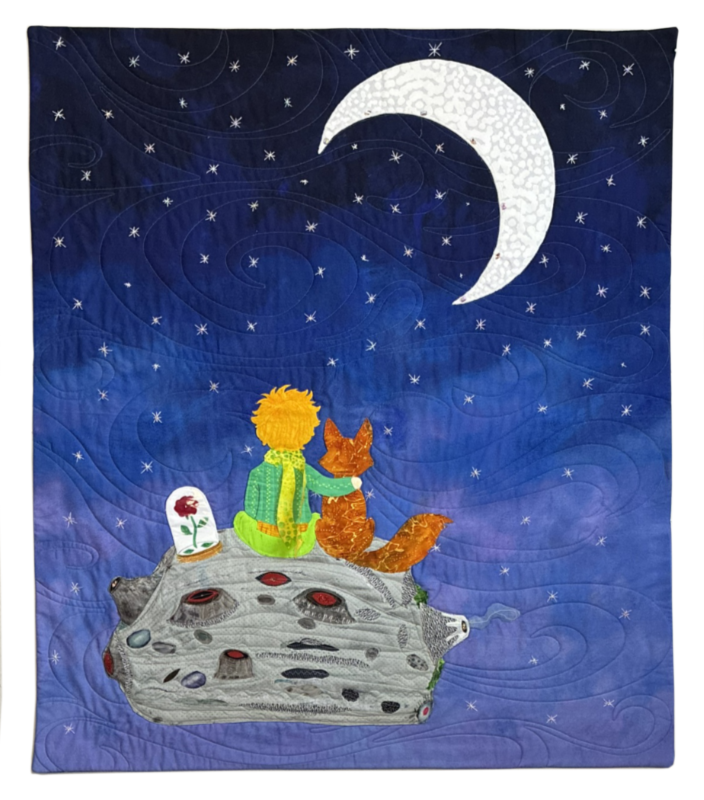 A quilt panel depicting a boy with yellow hair and green clothing sitting next to a fox on a moon-like surface, overlooking a starry night sky with a crescent moon.