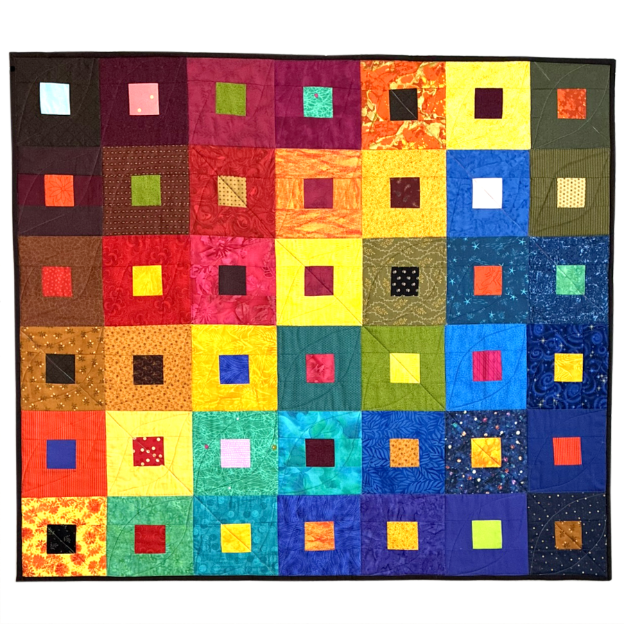 A colorful quilt with square patches in various bright colors and patterns, organized in a grid pattern with black borders.