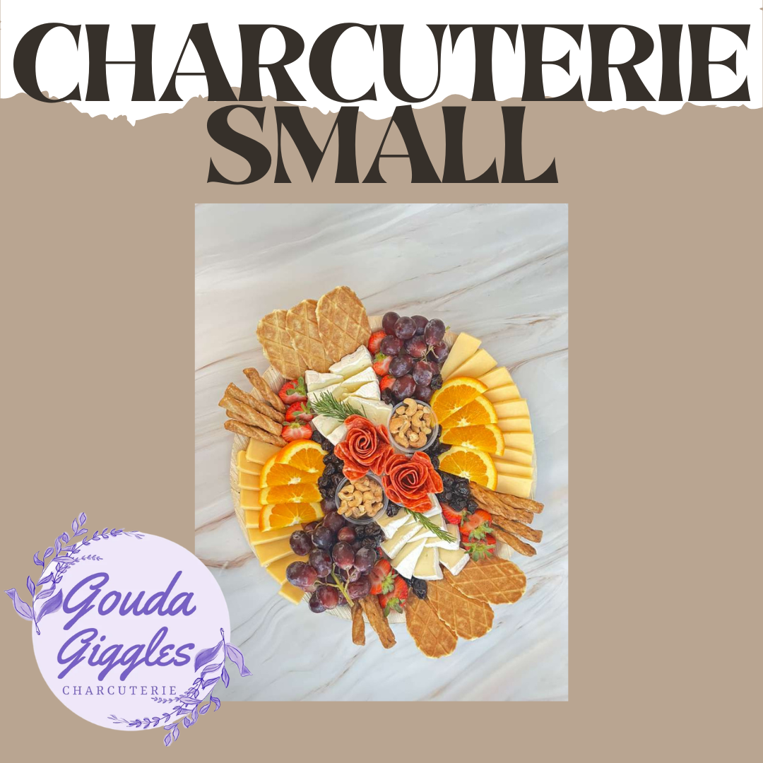 A charcuterie board with cheese, grapes, strawberries, orange slices, nuts, crackers, and salami, arranged on a marble surface with text reading "Charcuterie Small" and a logo for Gouda Giggles Charcuterie in the bottom left corner.