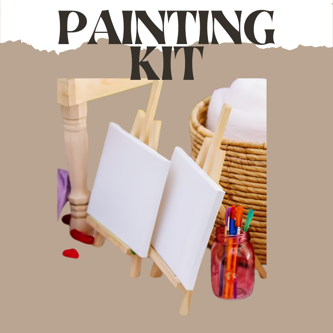 A mini painting kit setup with two blank canvases on small easels, a container of colored markers, a woven basket, and the words 'Painting Kit' at the top.