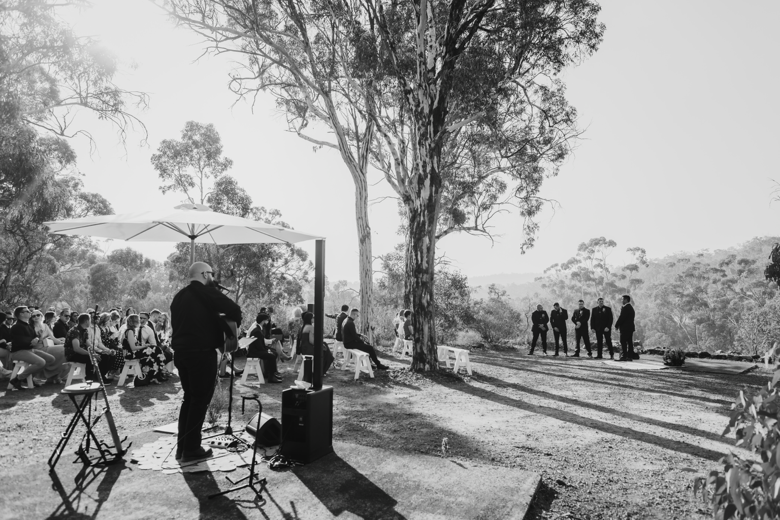Jamie Hall performing acoustic music at an outdoor wedding in Western Australia