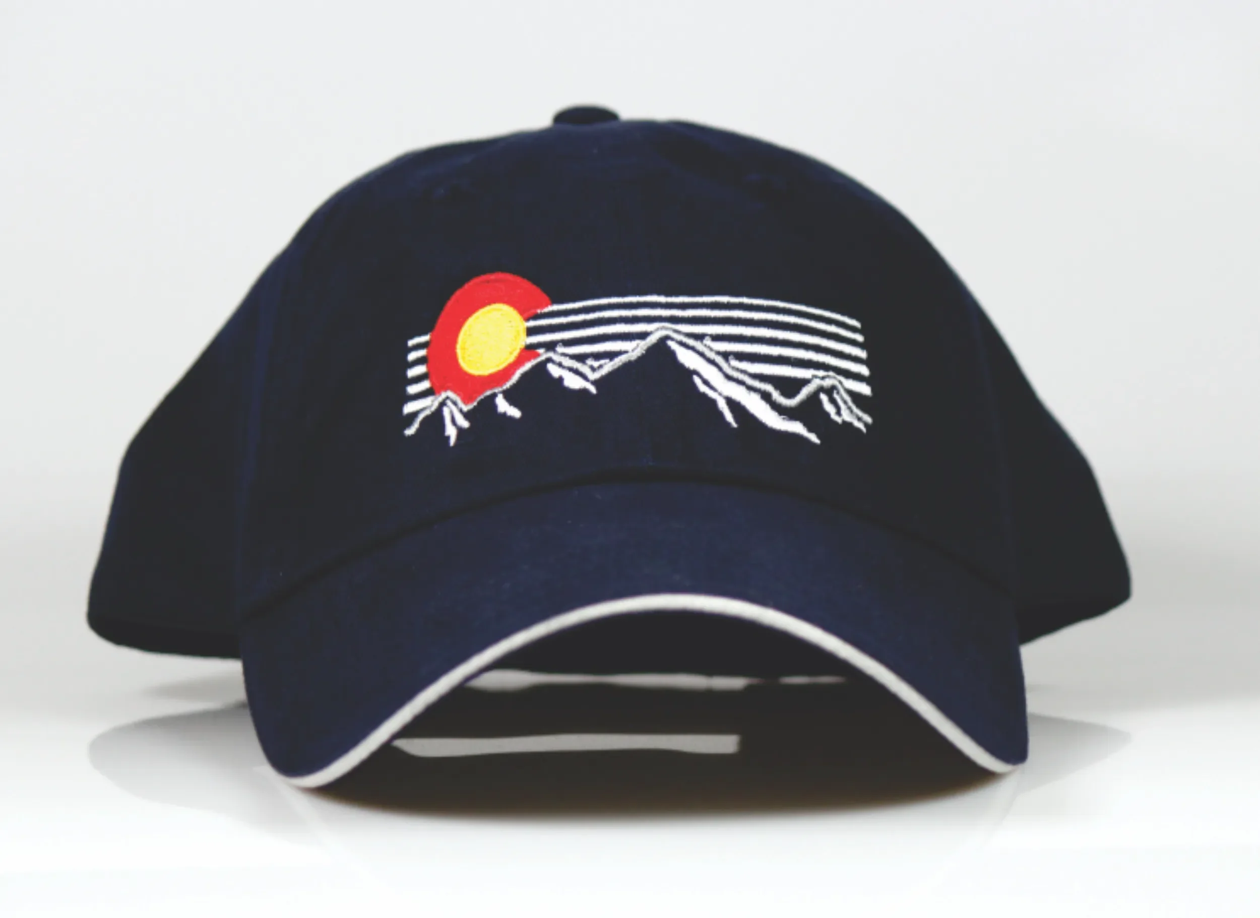 Hand digitized navy-blue Colorado custom embroidered caps in Siloam Springs, Arkansas.