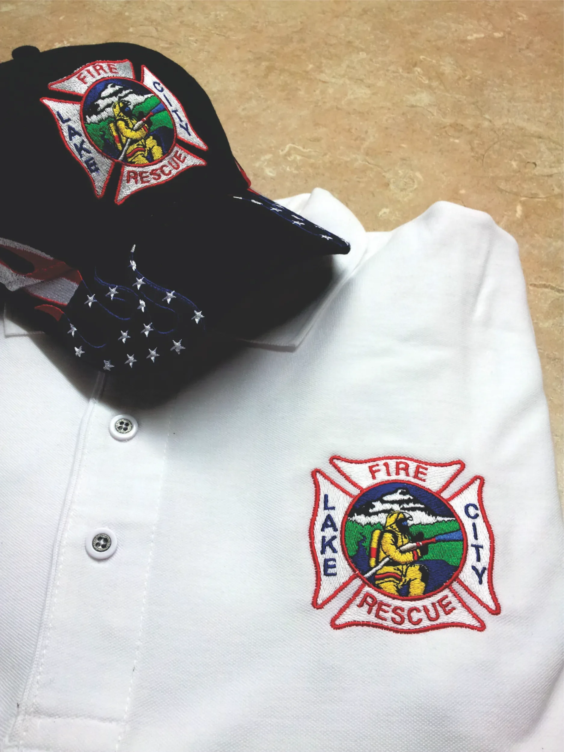 Hand digitized Lake City Fire Department custom embroidered cap and polo uniform set.