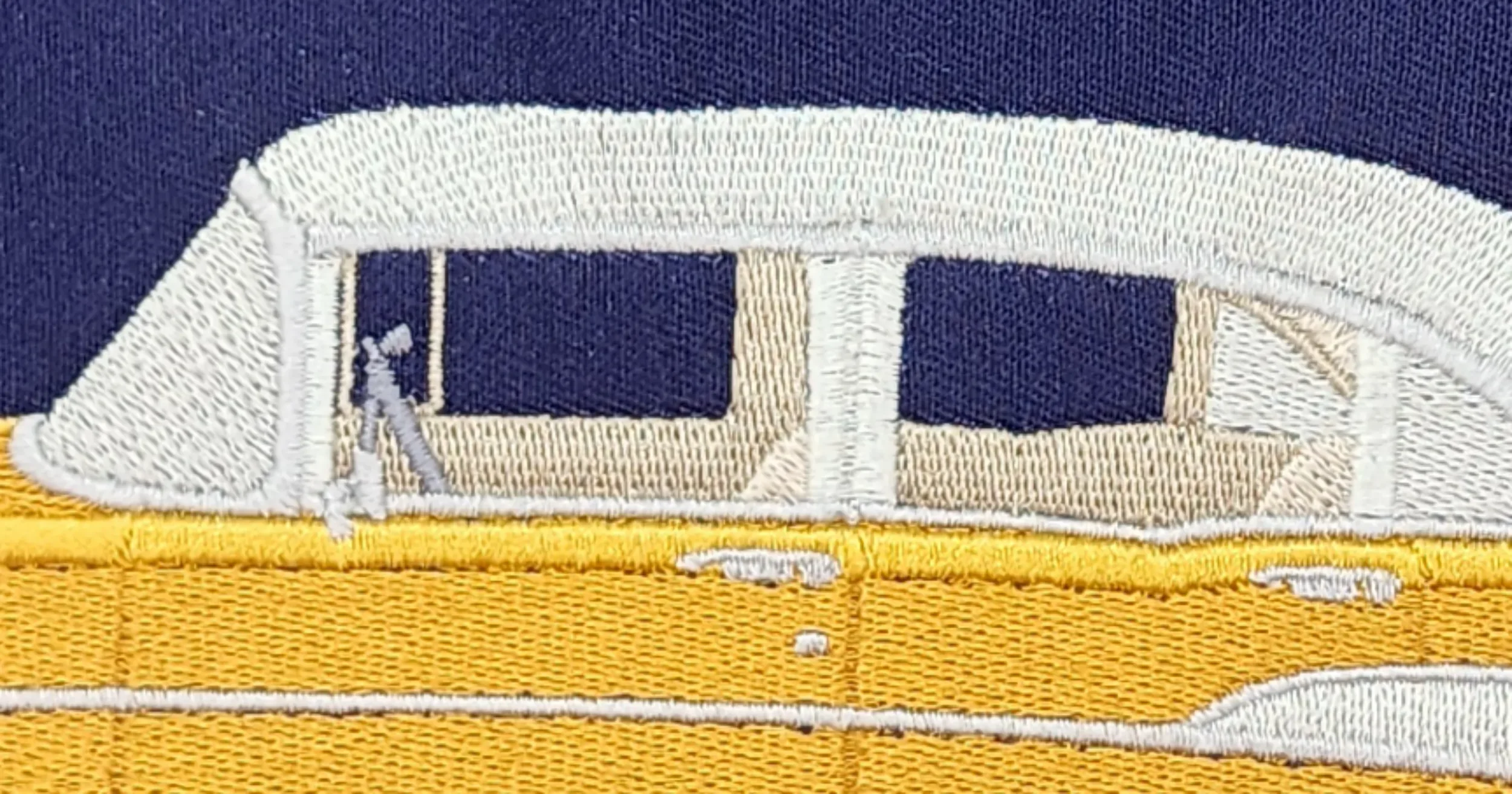 Image of close-up details of interior of 1957 Belair car embroidery.