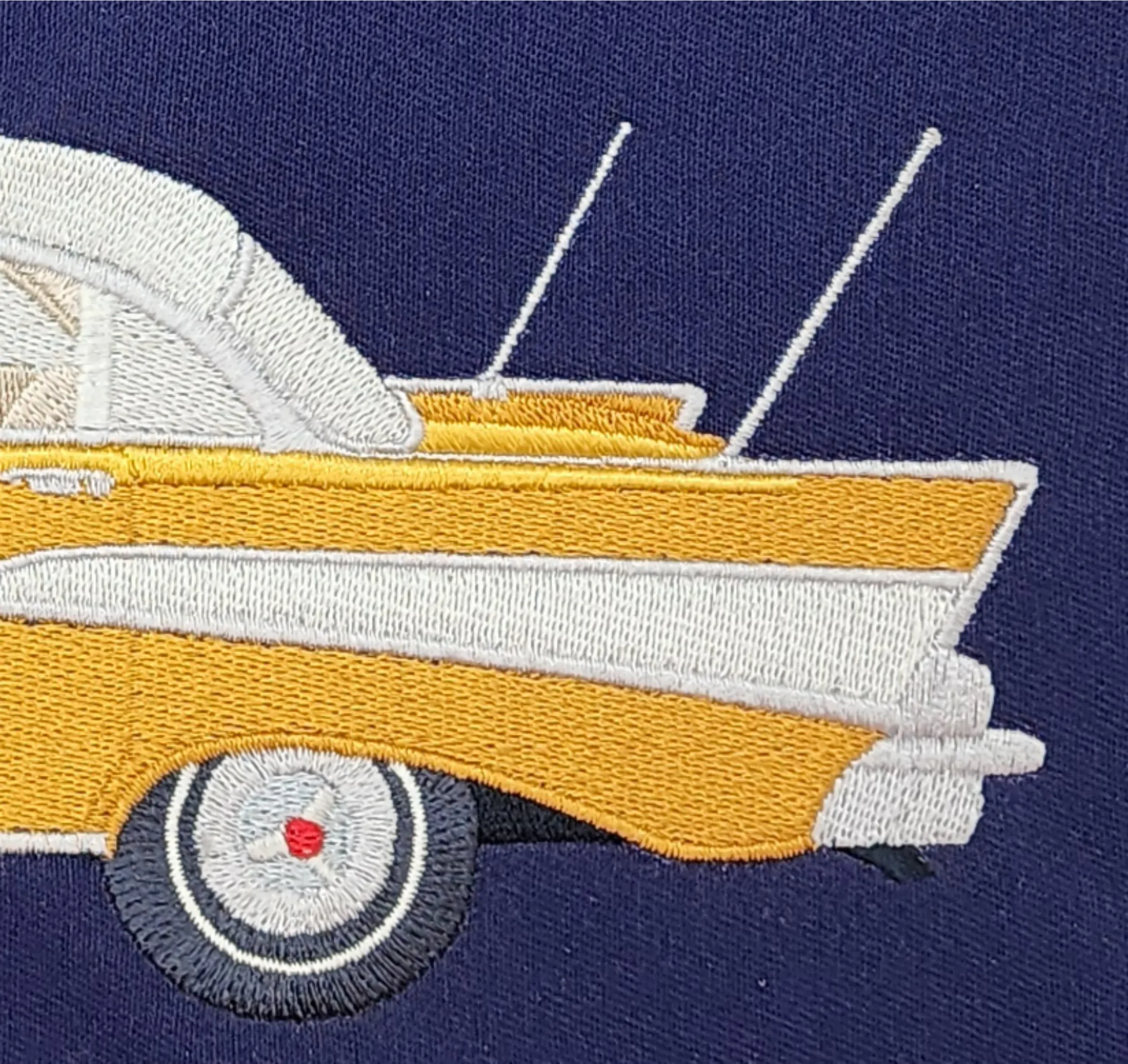 Image of close-up details of exterior of 1957 Belair car embroidery.