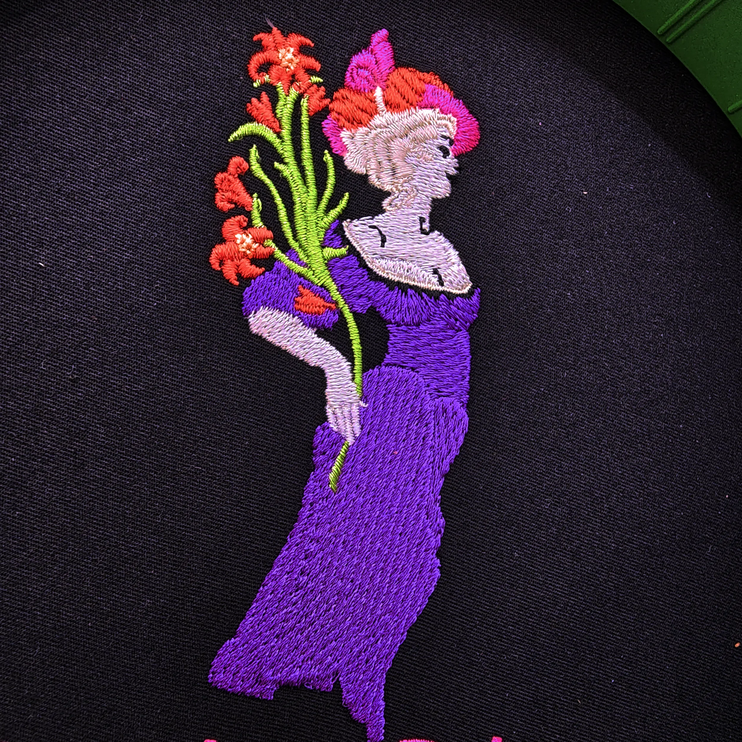 Custom hand digitized Floradora Saloon embroidered on apparel in Siloam Springs, Arkansas.