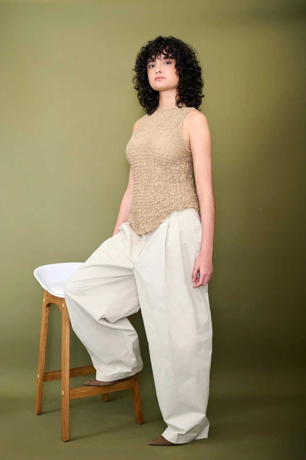 Defined dark curls cut to their natural pattern