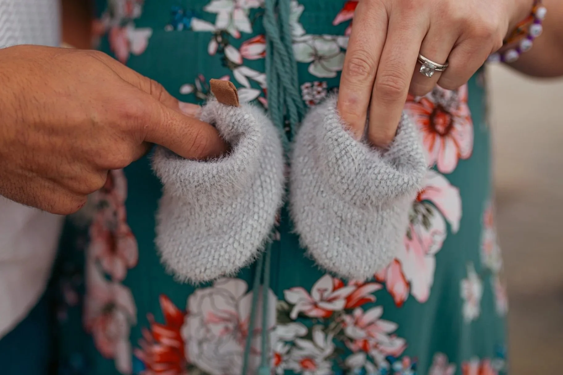 Close-up of baby shoes during a maternity session, San Diego maternity photographer