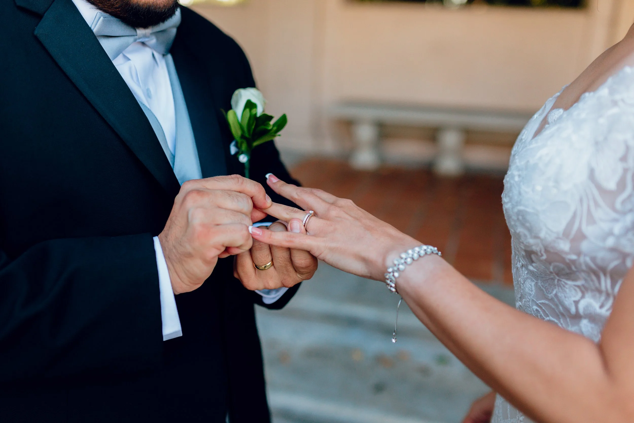 Wedding ring exchange during a Balboa Park ceremony, San Diego wedding photography